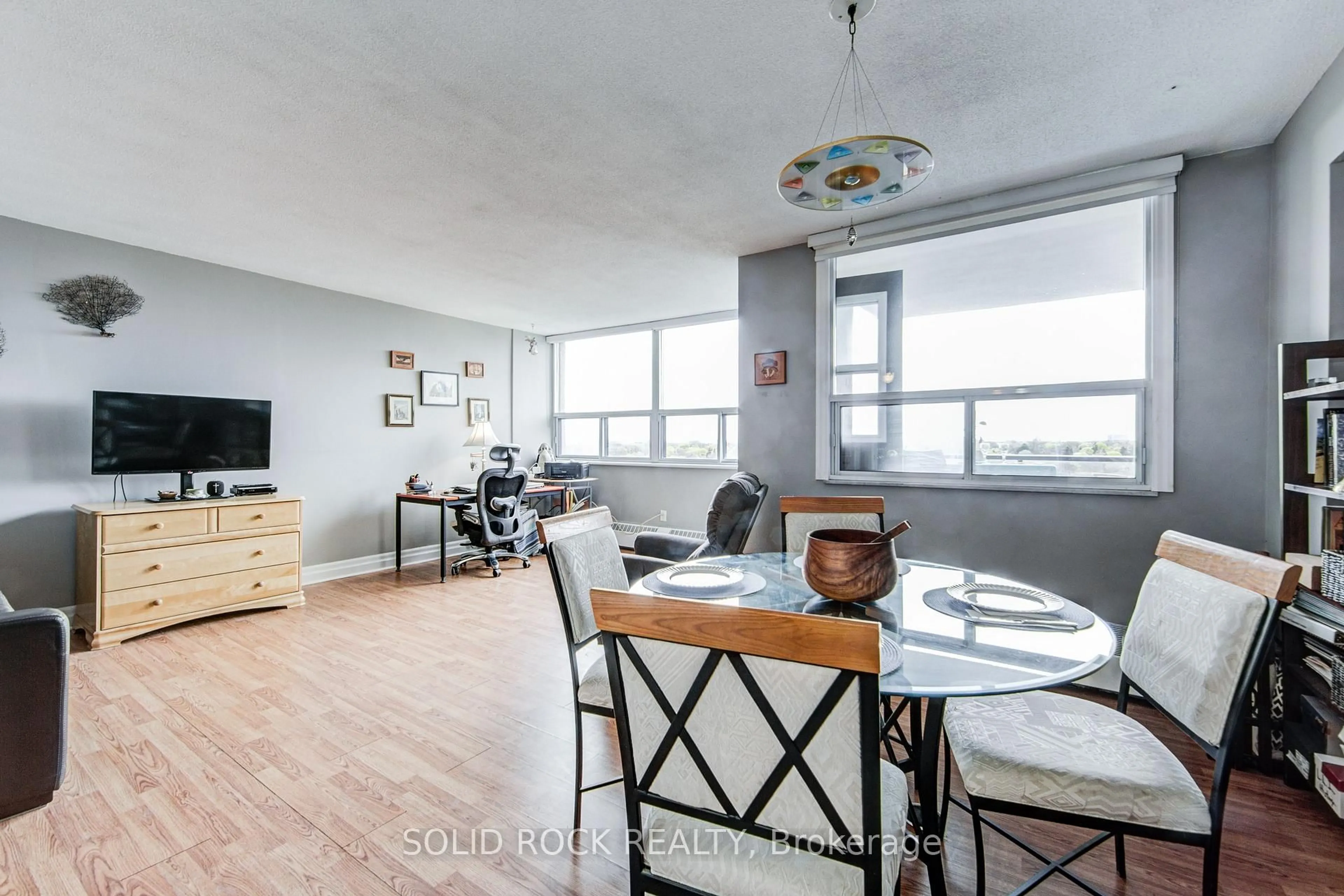 Living room with furniture, wood/laminate floor for 451 The West Mall #810, Toronto Ontario M9C 1G1