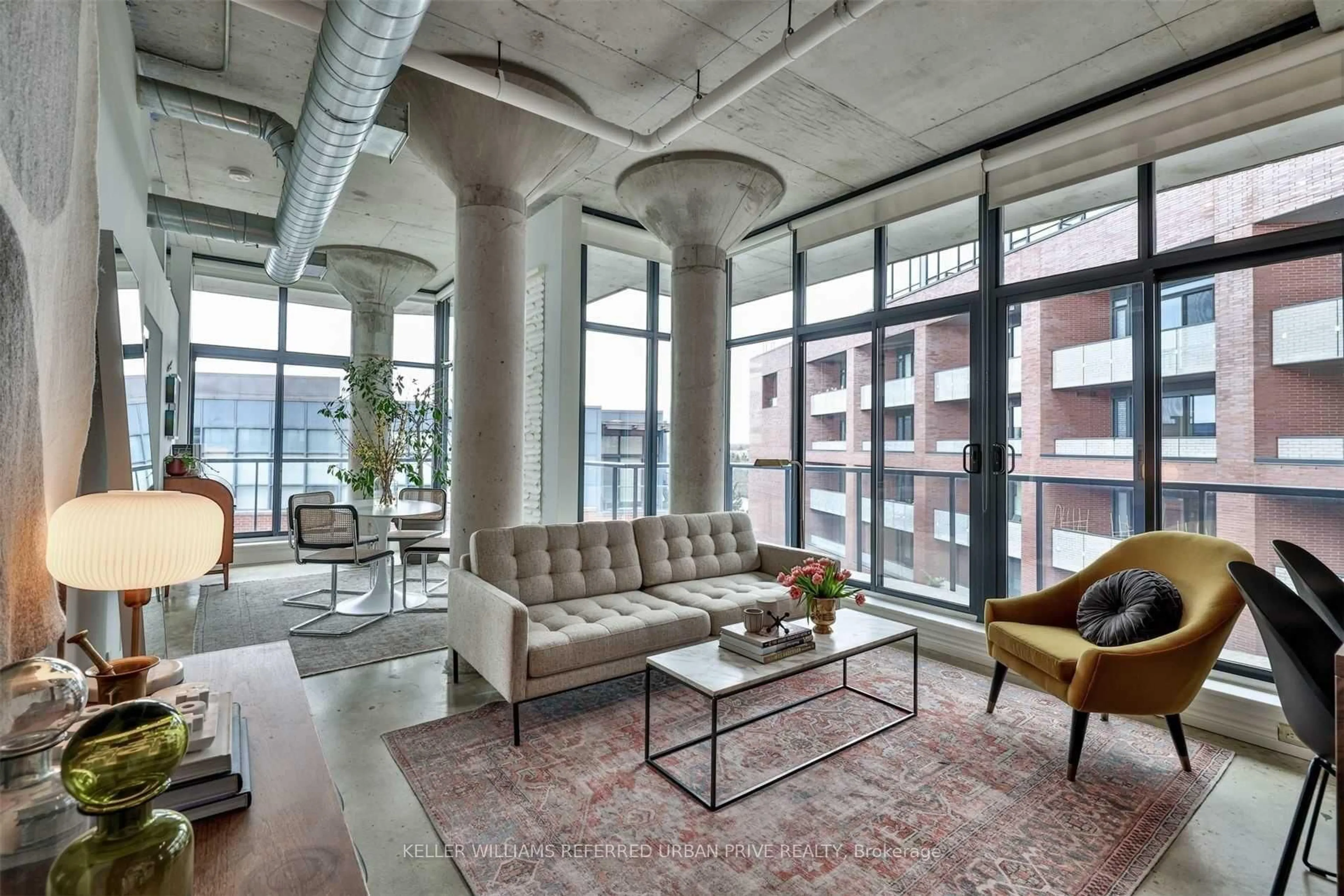 Living room with furniture, cement floor for 369 Sorauren Ave #602, Toronto Ontario M6R 3C2