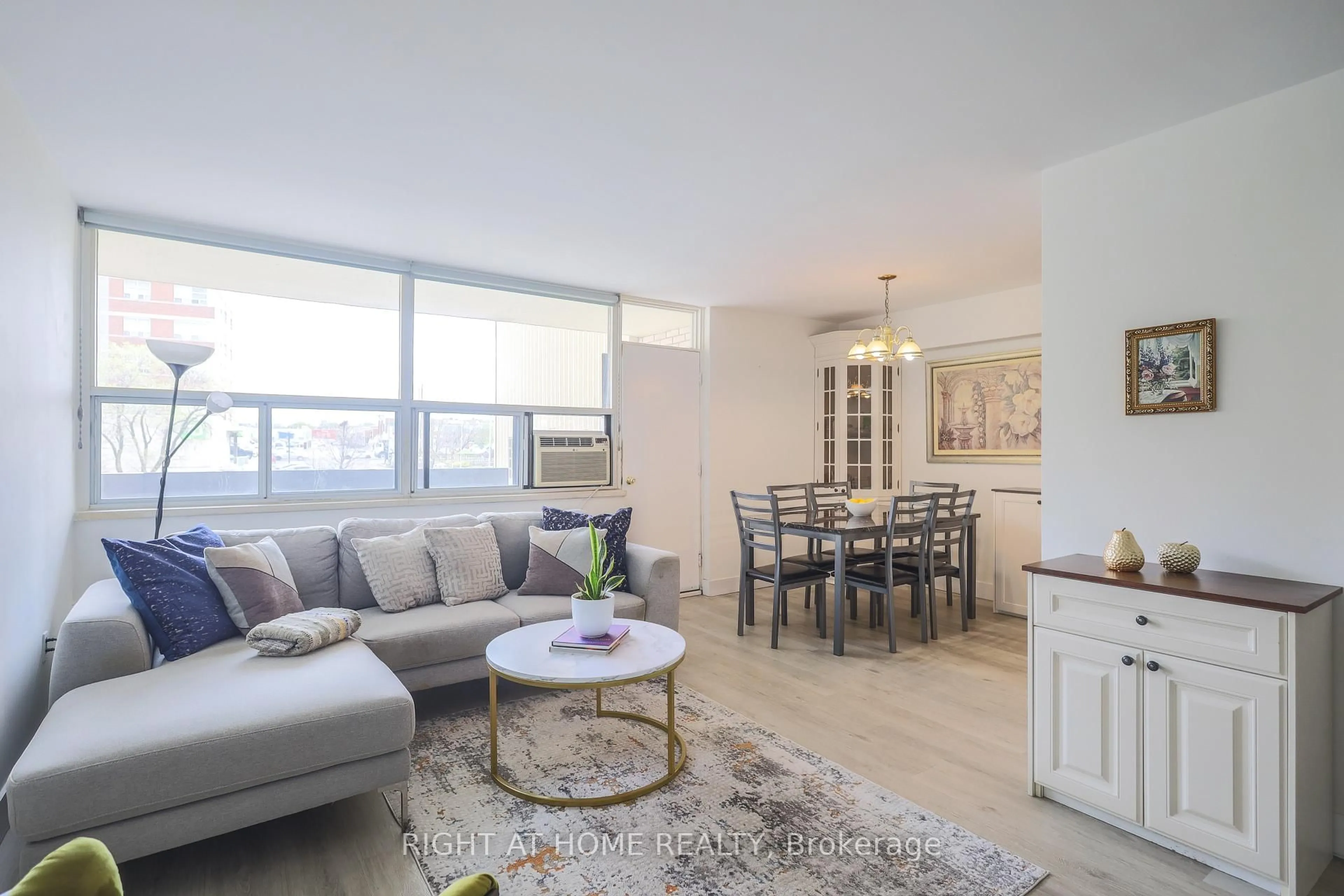 Living room with furniture, unknown for 1455 Lawrence Ave #207, Toronto Ontario M6L 1B1