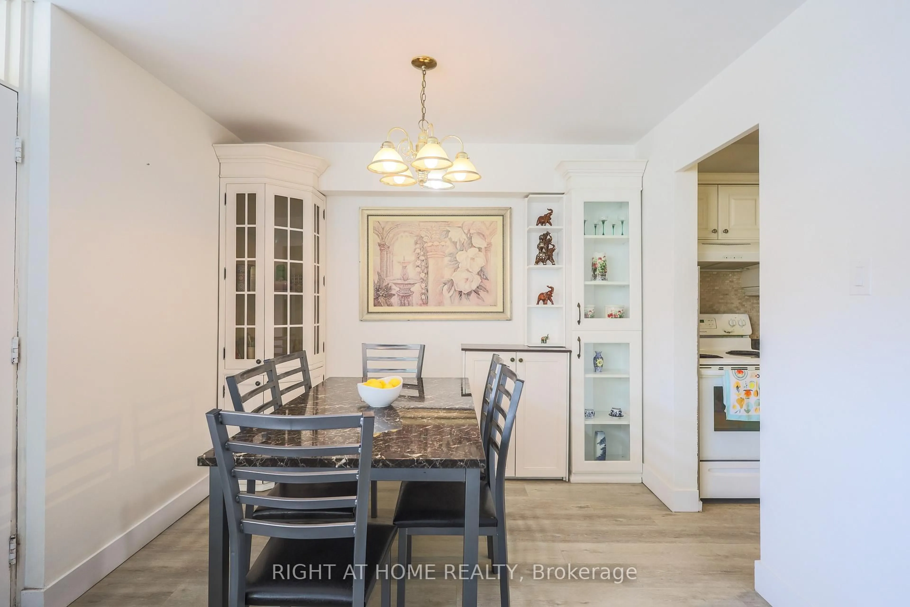 Dining room, wood/laminate floor for 1455 Lawrence Ave #207, Toronto Ontario M6L 1B1