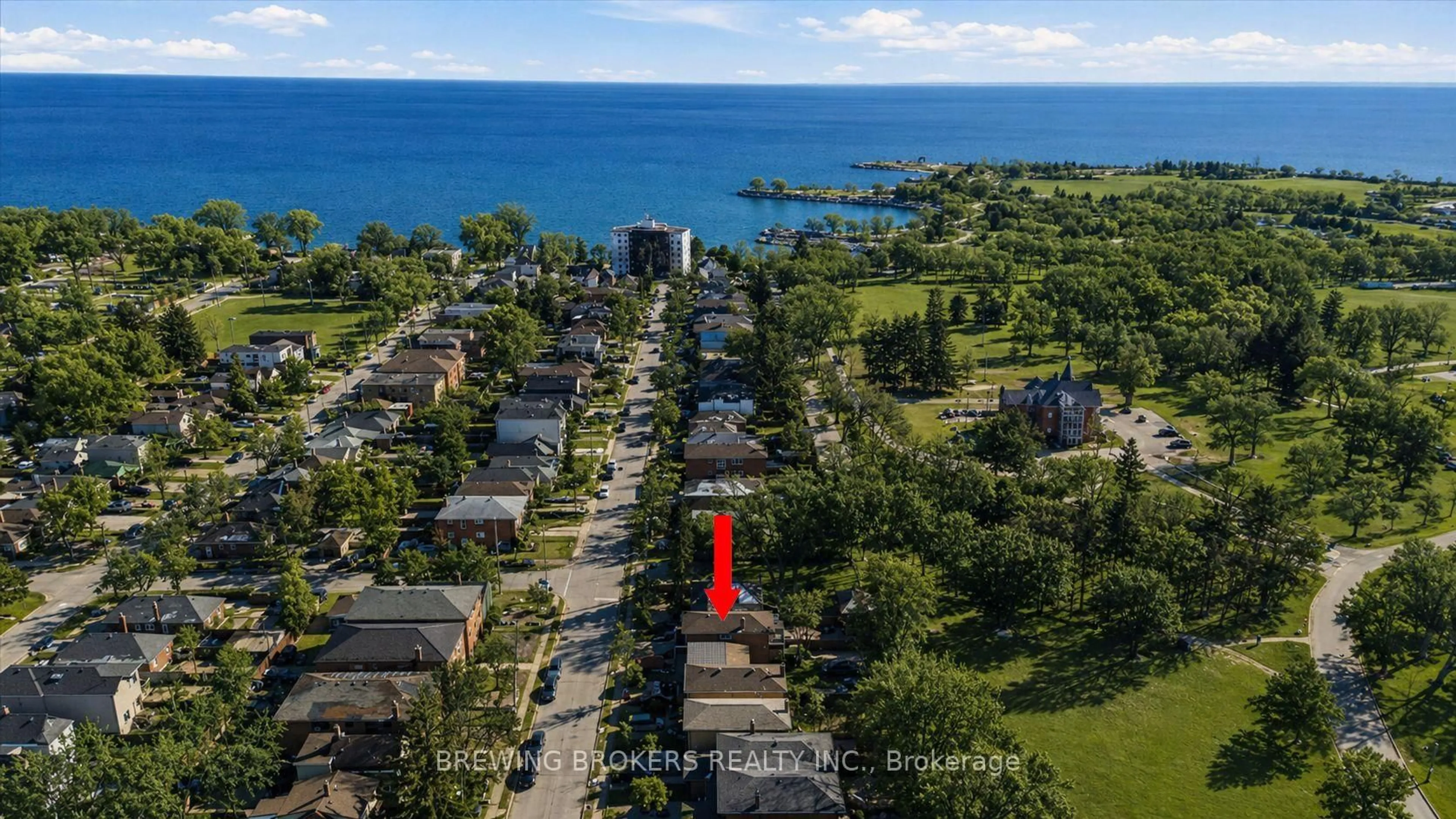 A pic from outside/outdoor area/front of a property/back of a property/a pic from drone, water/lake/river/ocean view for 72 Thirteenth St, Toronto Ontario M8V 3H6