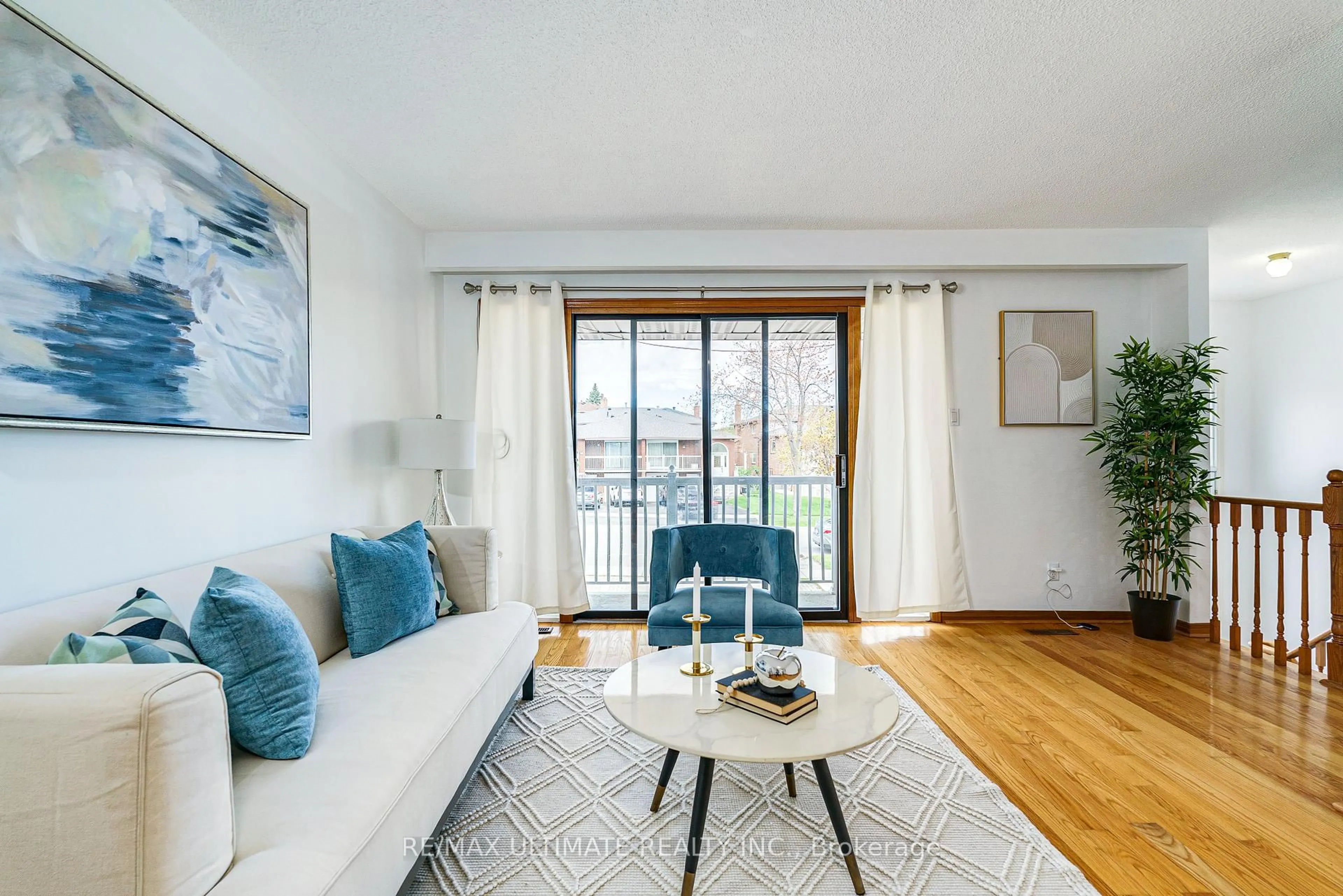 Living room with furniture, wood/laminate floor for 196 Meadows Blvd, Mississauga Ontario L4Z 1J9