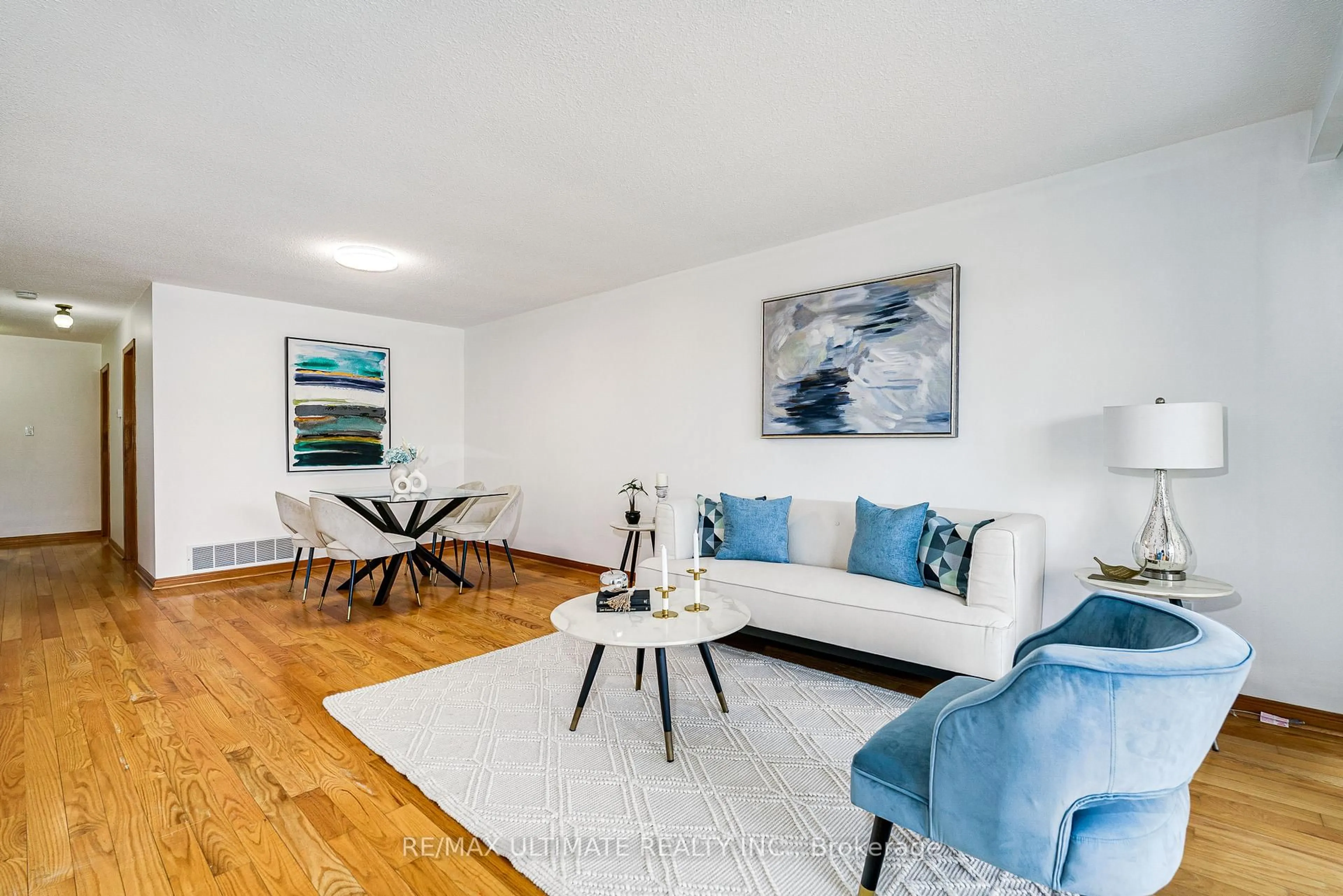 Living room with furniture, wood/laminate floor for 196 Meadows Blvd, Mississauga Ontario L4Z 1J9