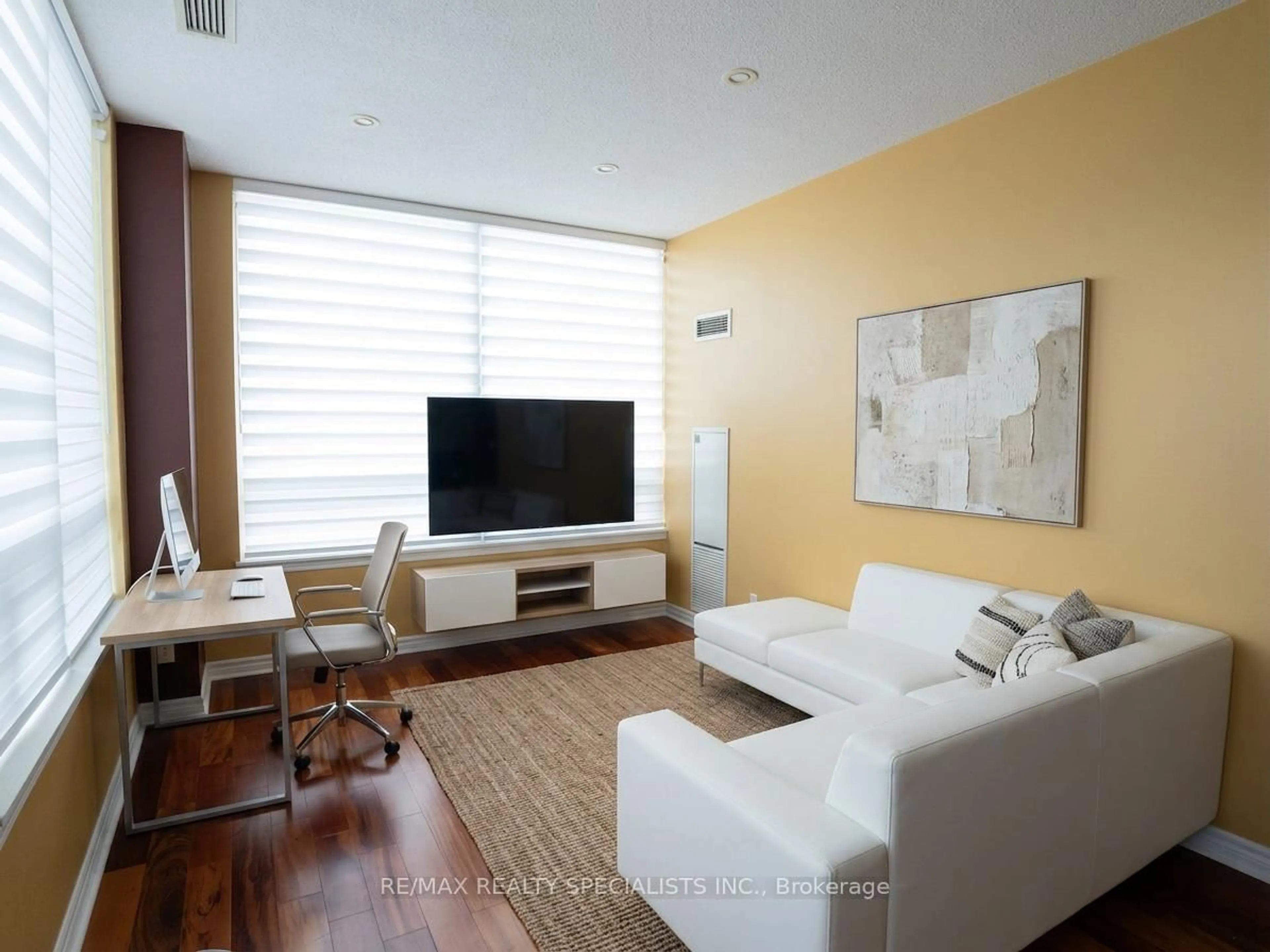 Living room with furniture, wood/laminate floor for 3504 Hurontario St #307, Mississauga Ontario L5B 0B9