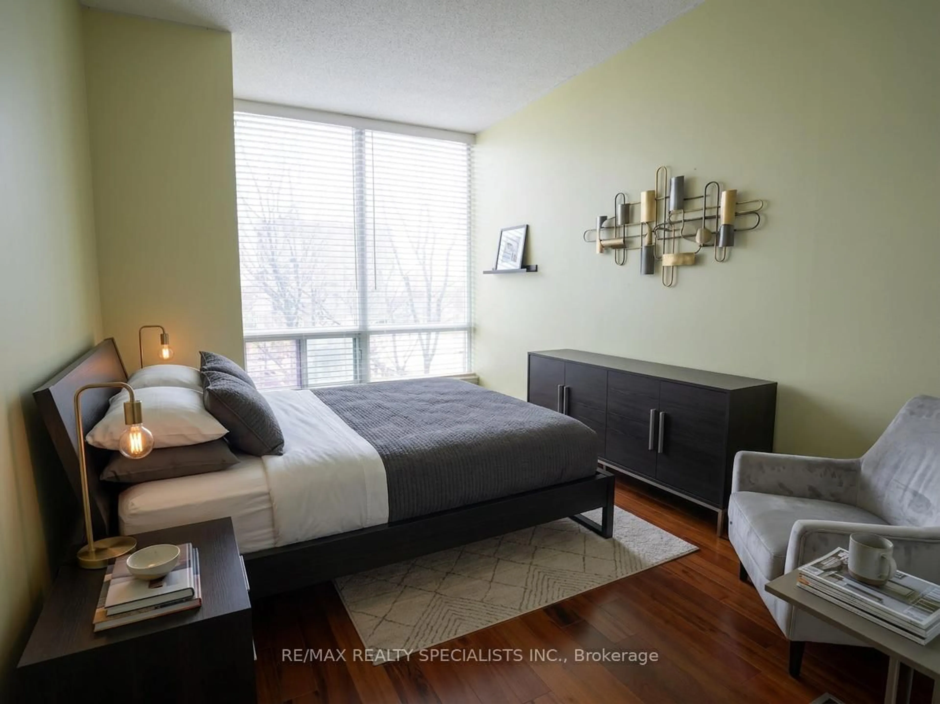 Bedroom with bed, wood/laminate floor for 3504 Hurontario St #307, Mississauga Ontario L5B 0B9