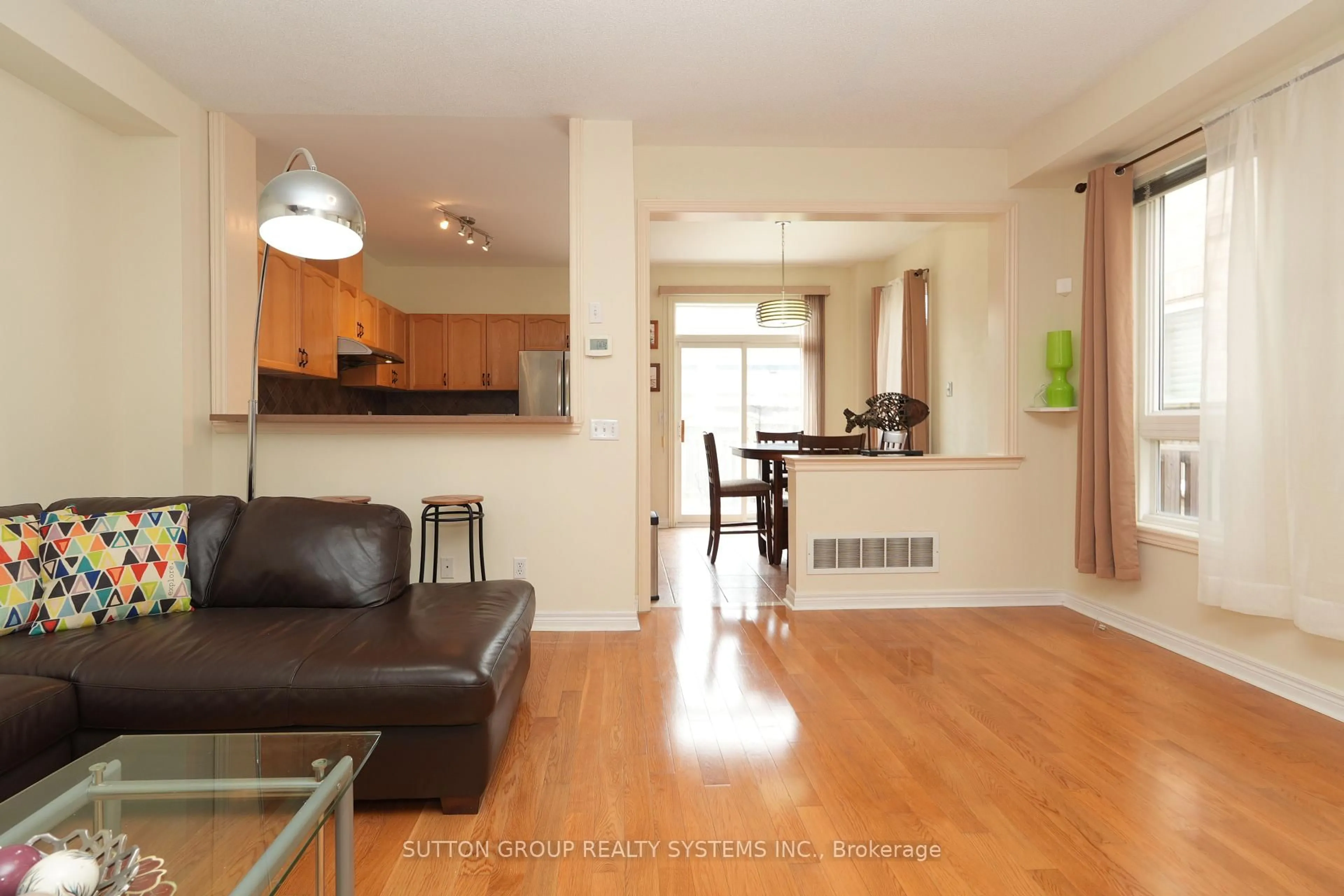 Living room with furniture, wood/laminate floor for 5636 Raleigh St, Mississauga Ontario L5M 7E4