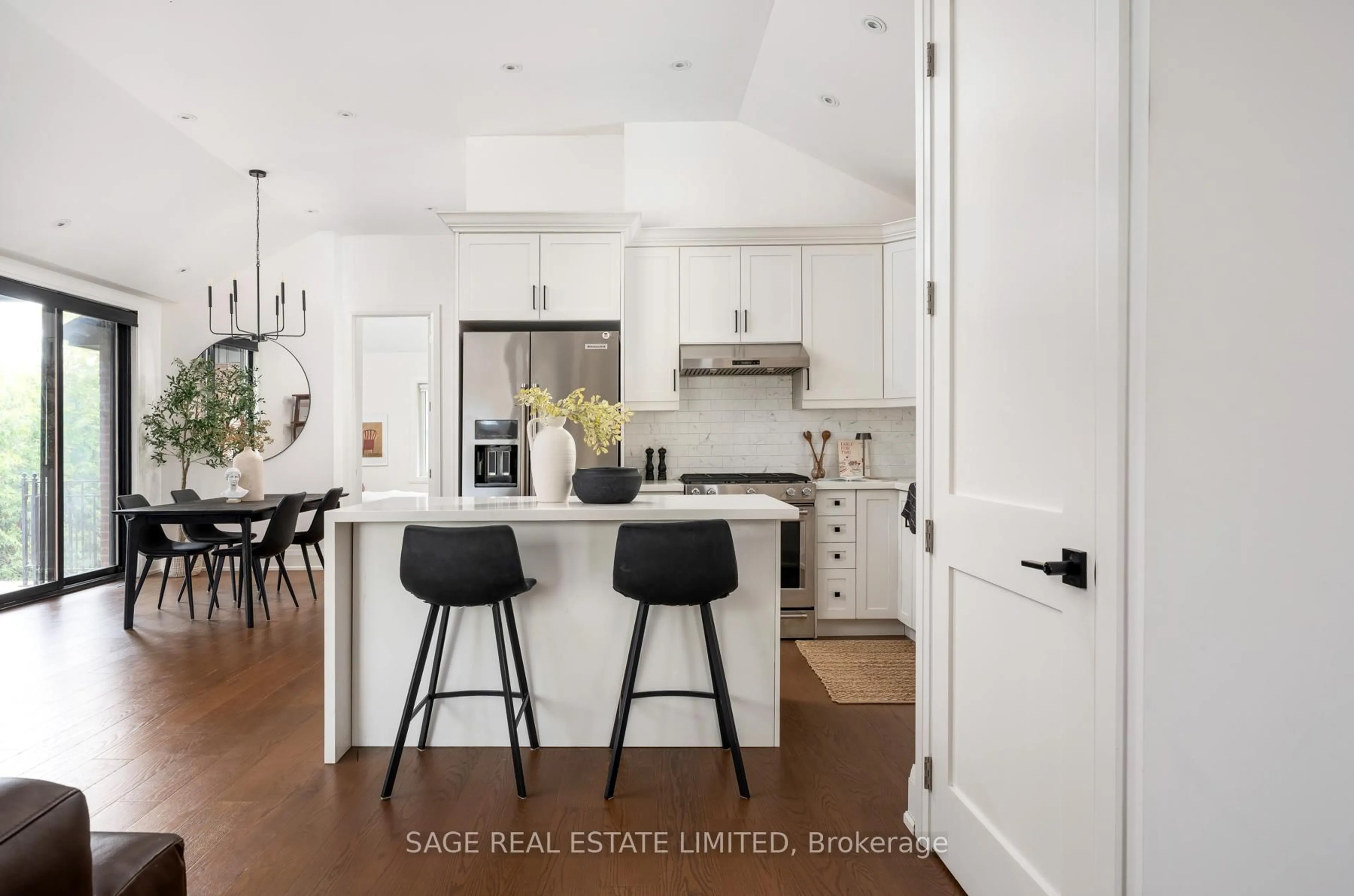Open concept kitchen, wood/laminate floor for 7 Rathgar Ave, Toronto Ontario M9C 2E7