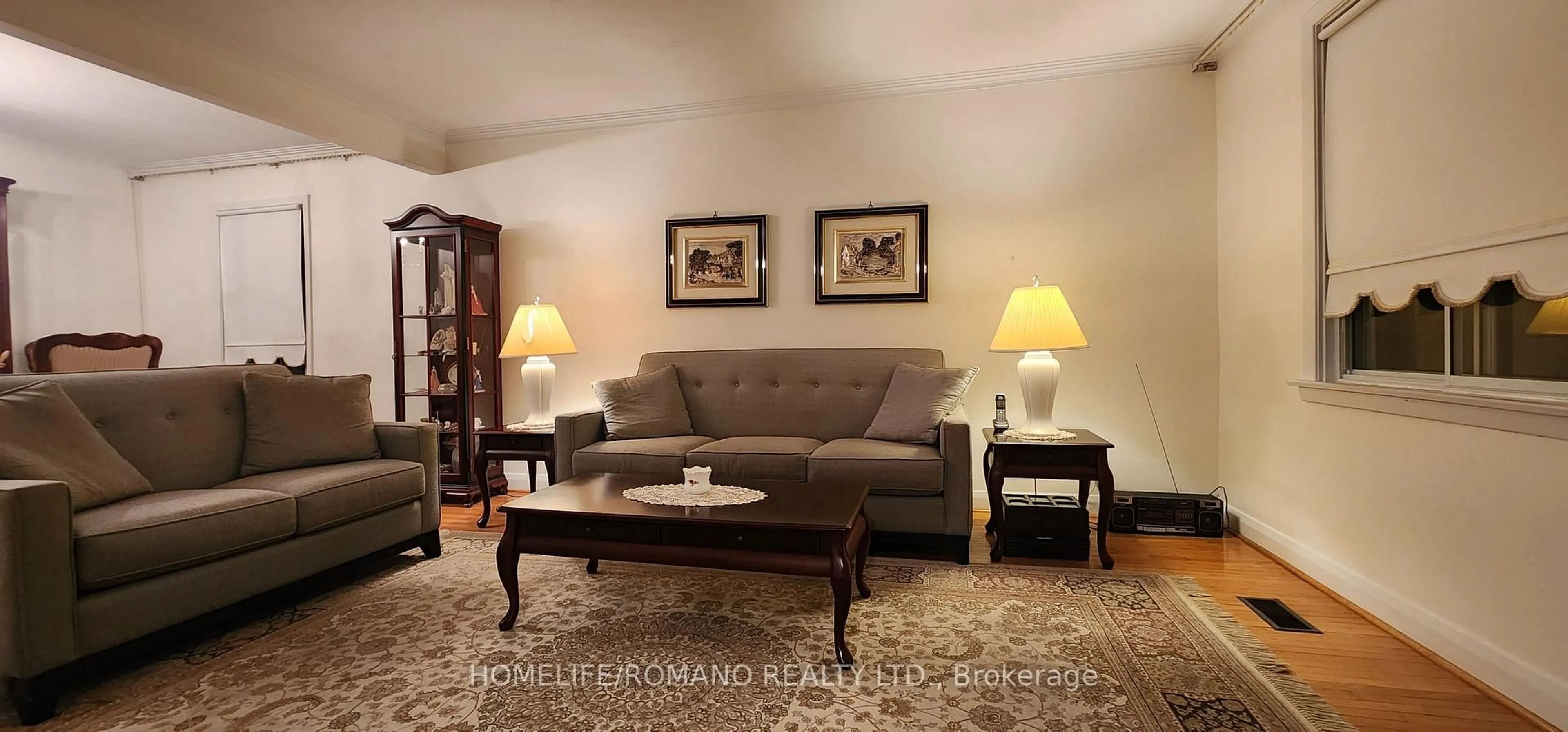 Living room with furniture, wood/laminate floor for 24 Katherine Rd, Toronto Ontario M3K 1H9