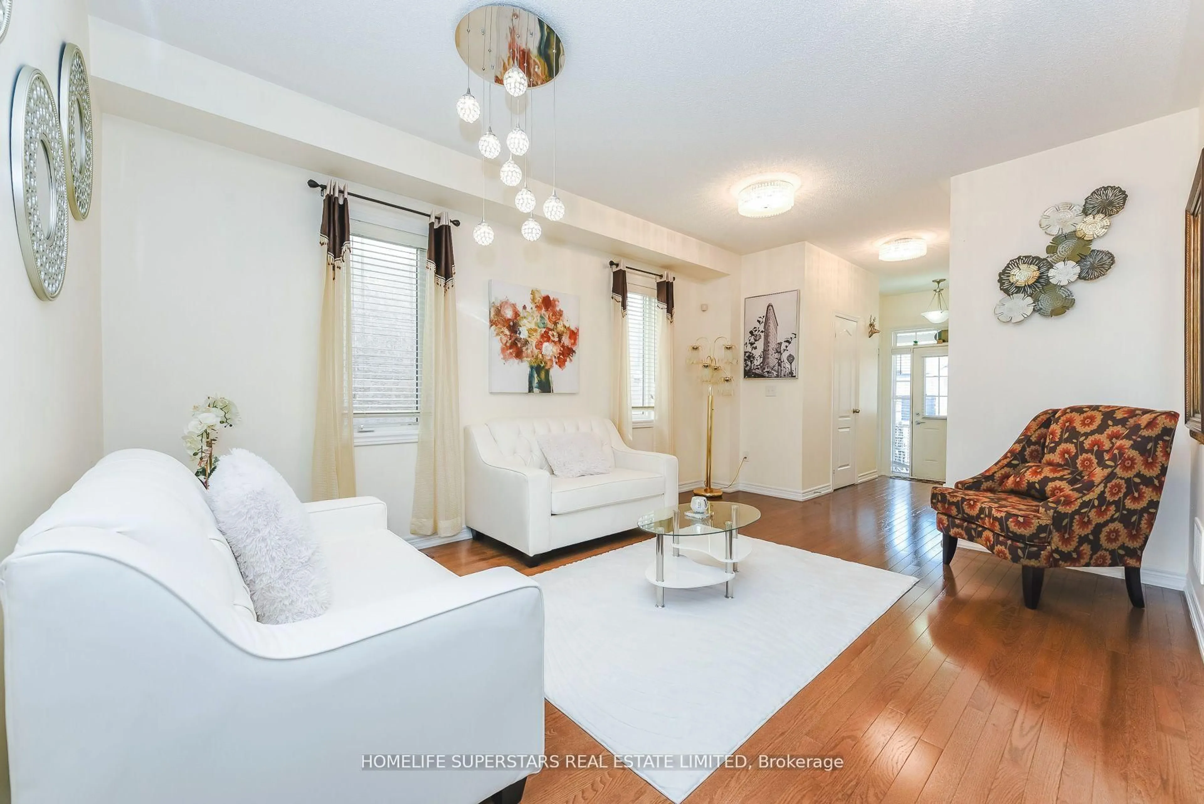 Living room with furniture, wood/laminate floor for 16 Altura Way, Brampton Ontario L6P 4A1