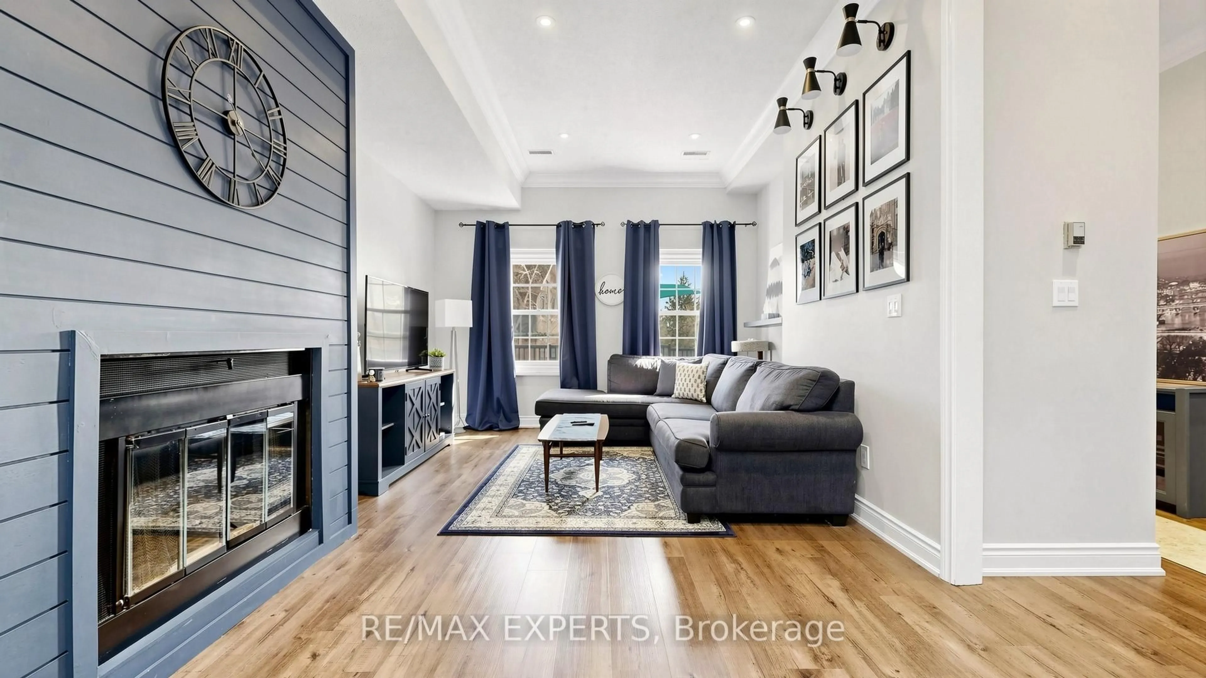 Living room with furniture, wood/laminate floor for 7 Warbrick Lane, Caledon Ontario L7E 1G3