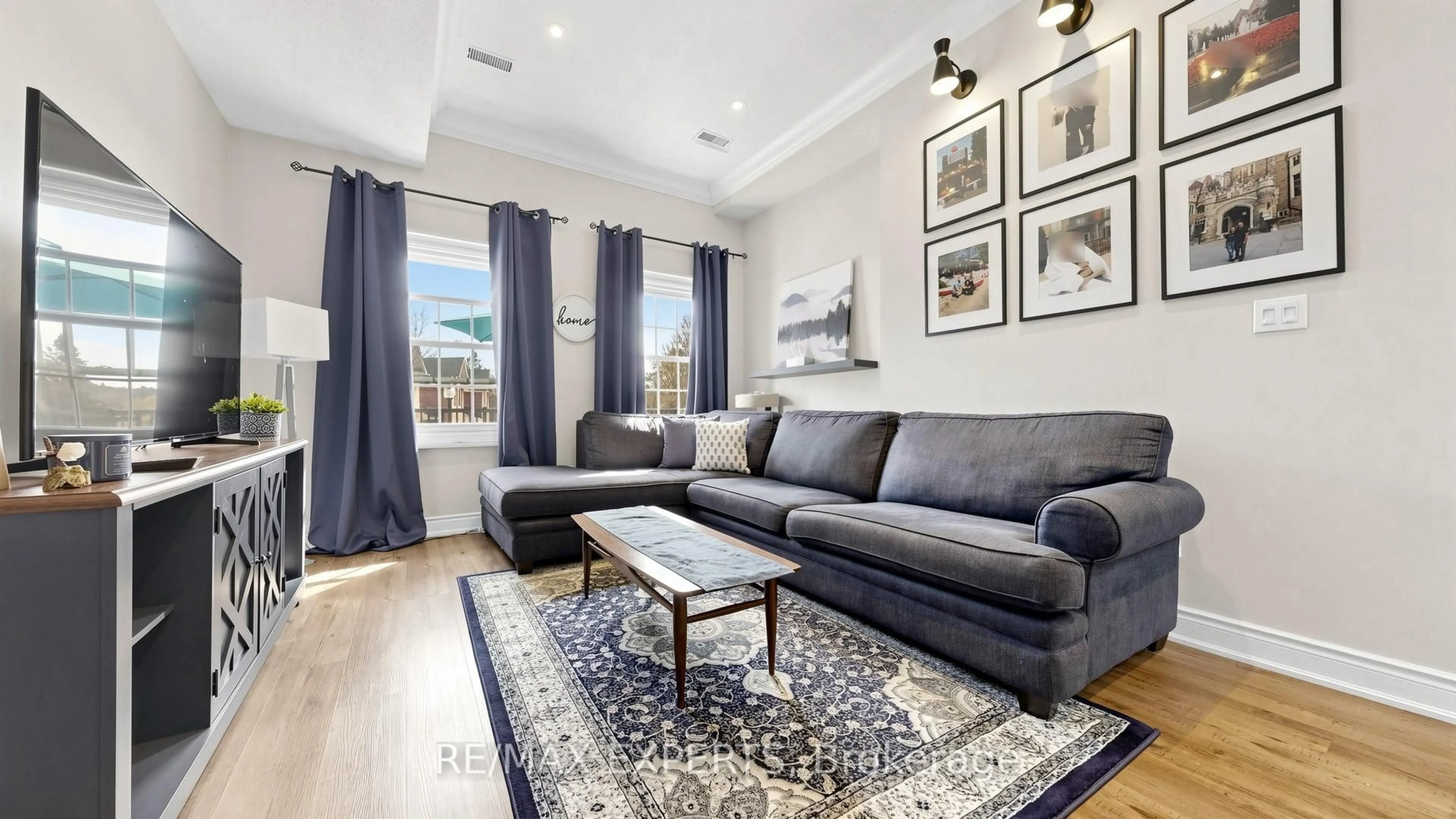 Living room with furniture, wood/laminate floor for 7 Warbrick Lane, Caledon Ontario L7E 1G3