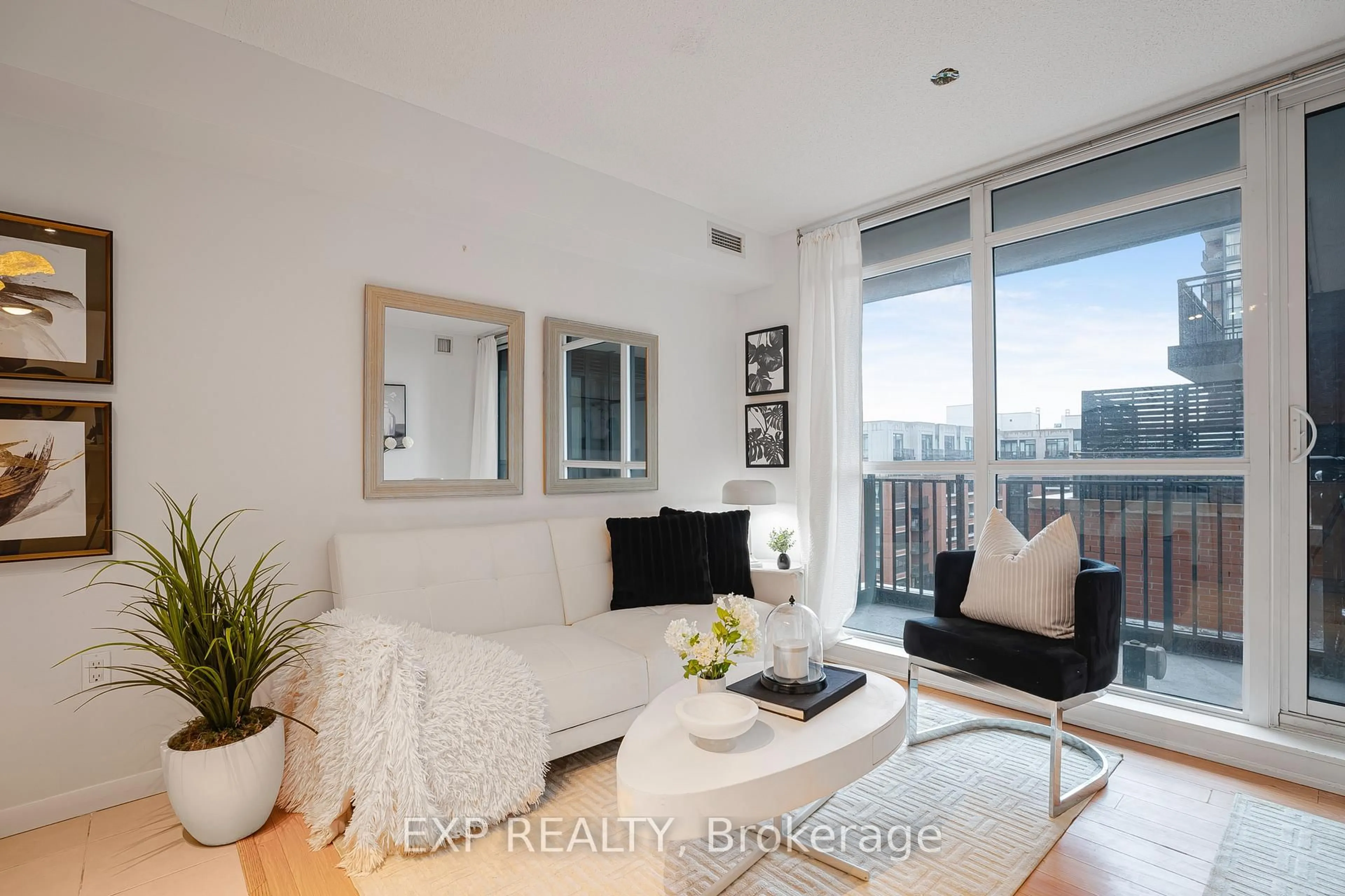 Living room with furniture, wood/laminate floor for 830 Lawrence Ave #729, Toronto Ontario M6A 0A2