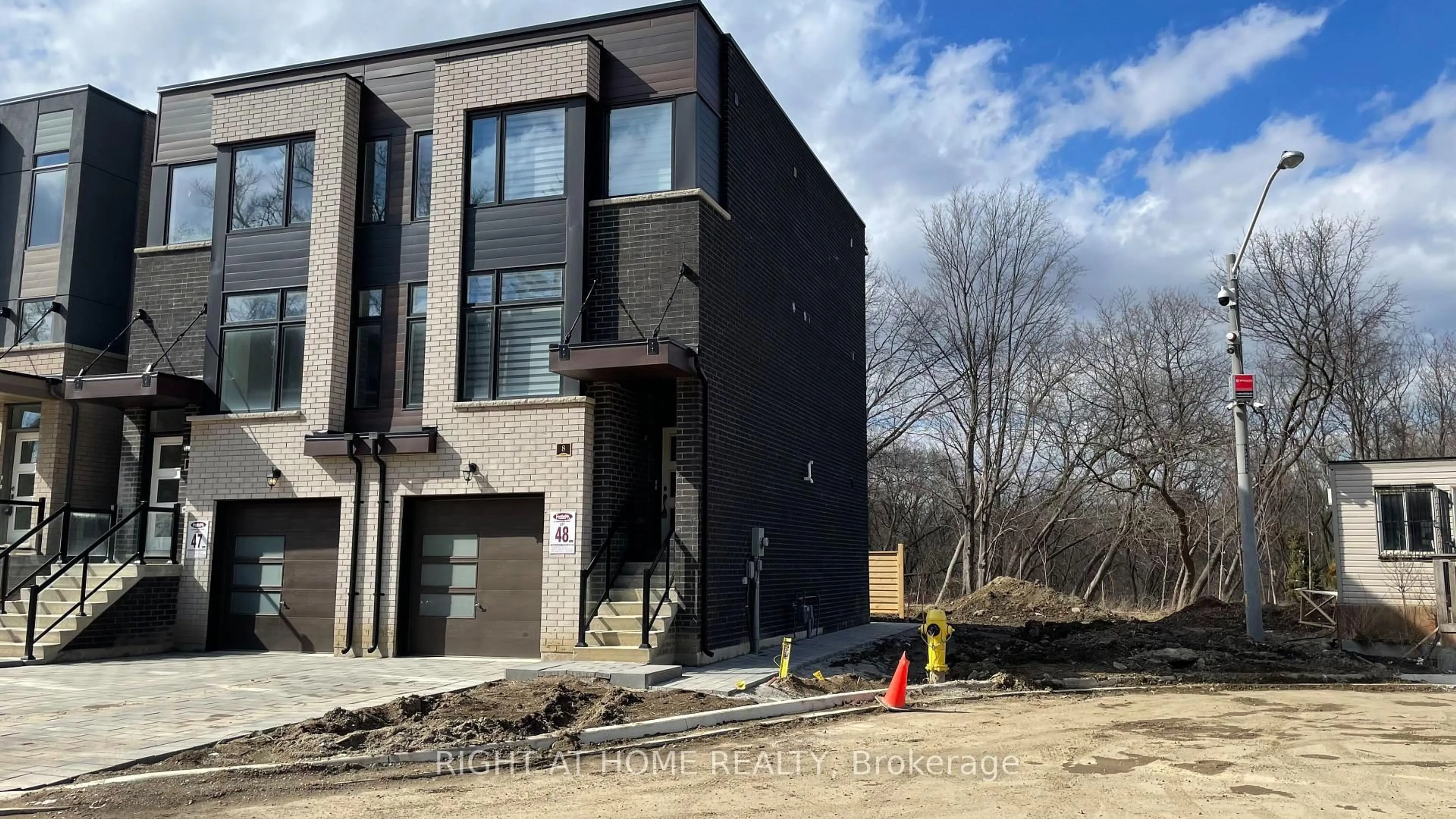 Home with brick exterior material, building for 8 Creekbank Rd, Toronto Ontario M6L 0A4
