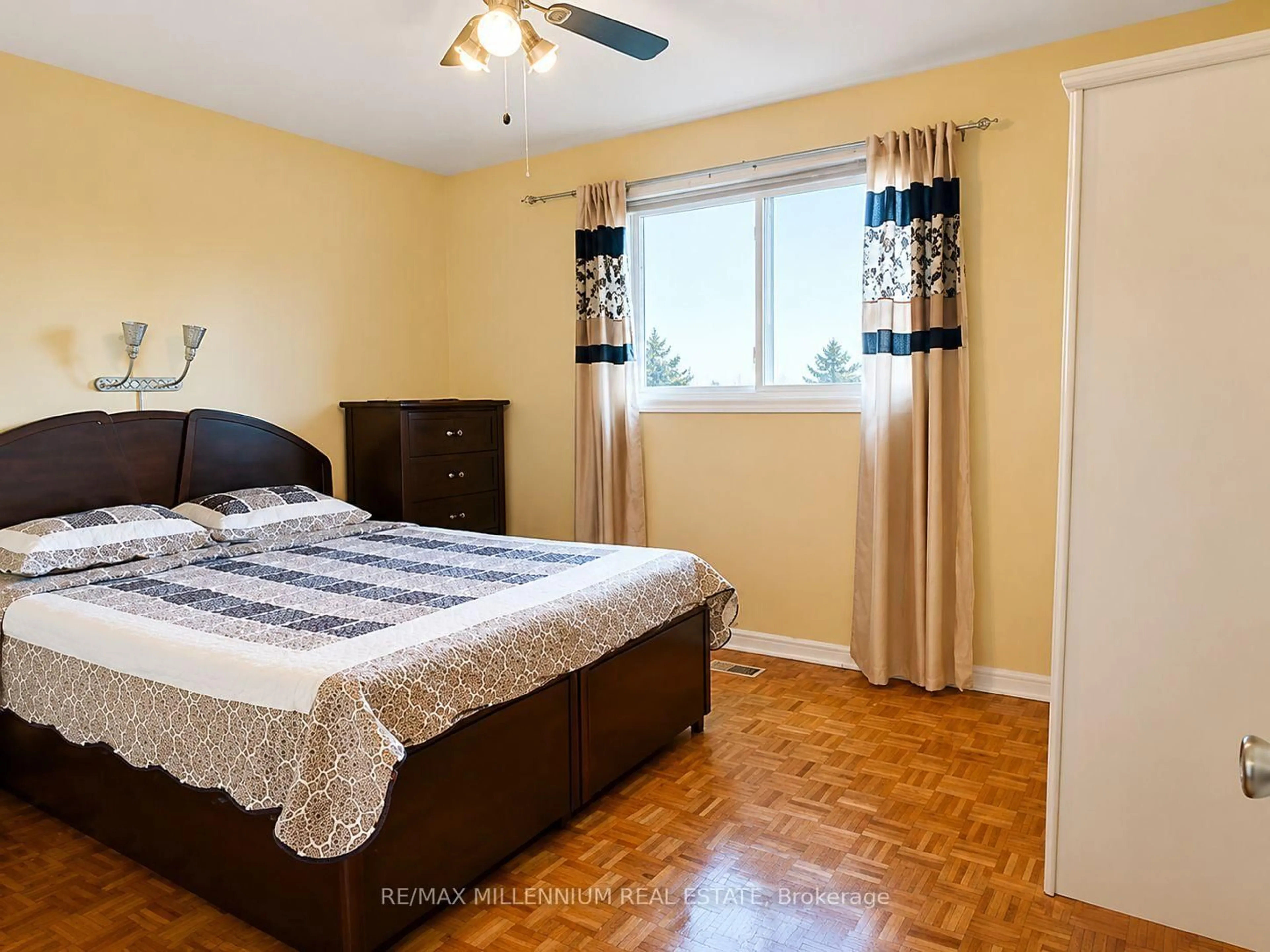 Bedroom with bed, wood/laminate floor for 29 Major Oaks Dr, Brampton Ontario L6V 3K1