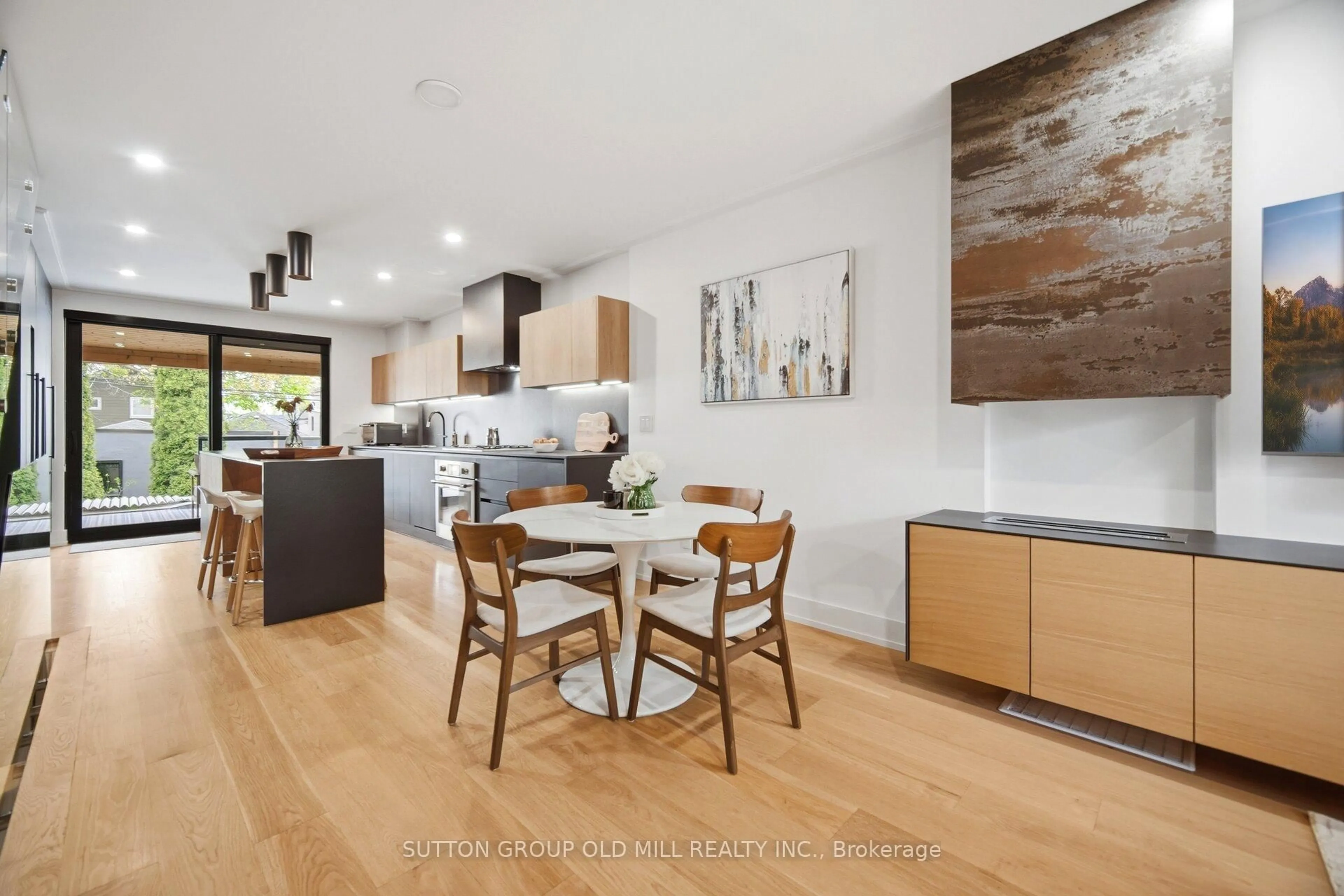 Open concept kitchen, wood/laminate floor for 87 Mackay Ave, Toronto Ontario M6H 2N7