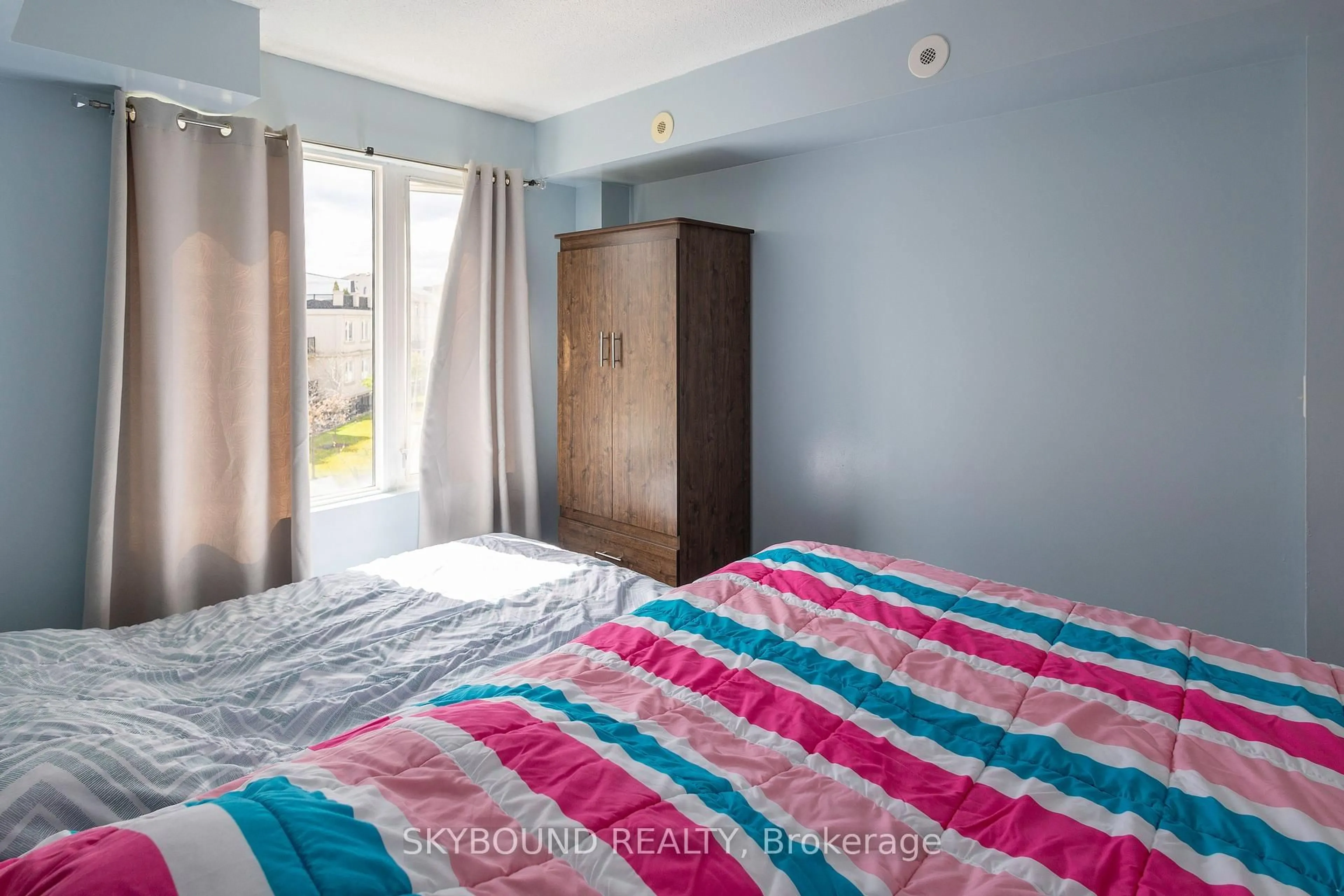 Bedroom with bed, unknown for 3043 Finch Ave #2033, Toronto Ontario M9M 0A4