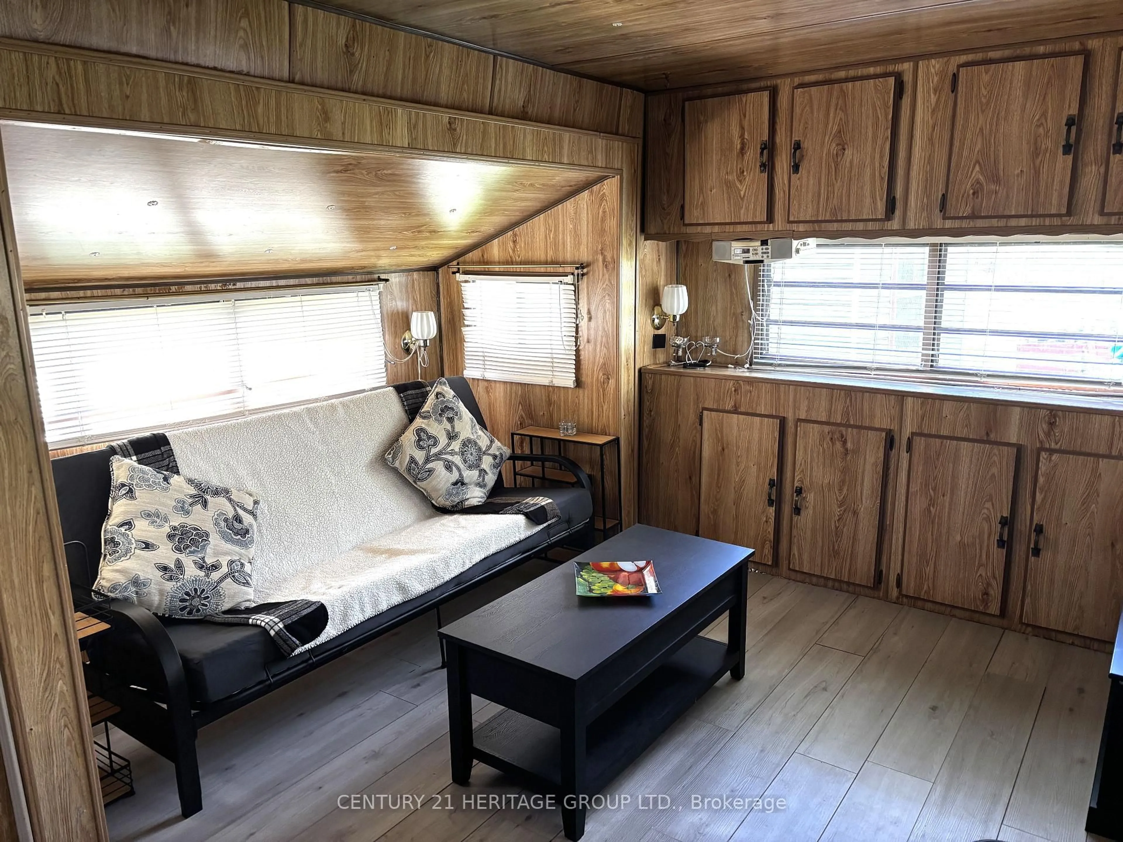 Living room with furniture, wood/laminate floor for 14221 Winston Churchill Blvd #Lot 40, Caledon Ontario L7C 1N6