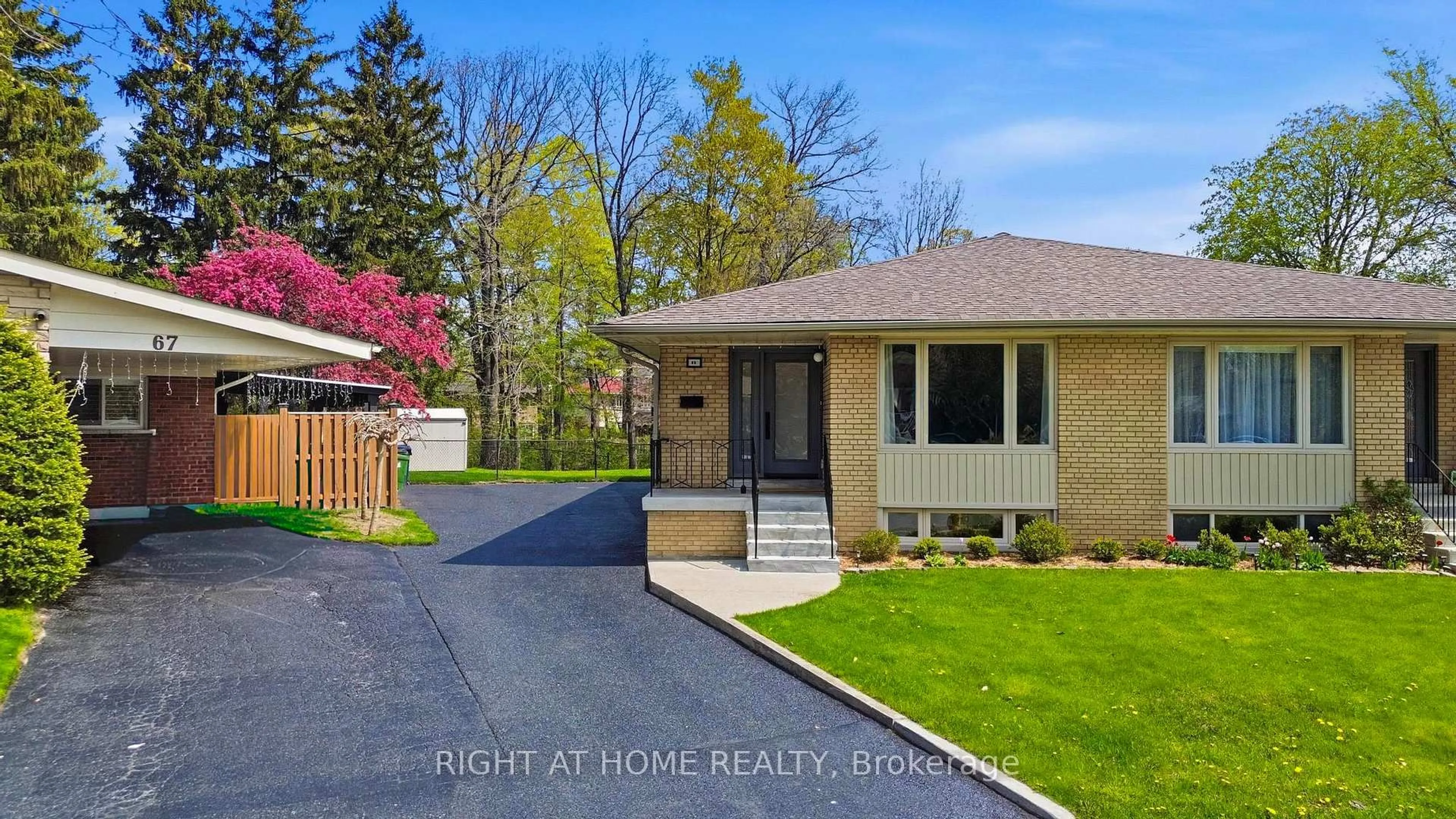 Home with brick exterior material, street for 65 Vanguard Dr, Toronto Ontario M9B 5E8
