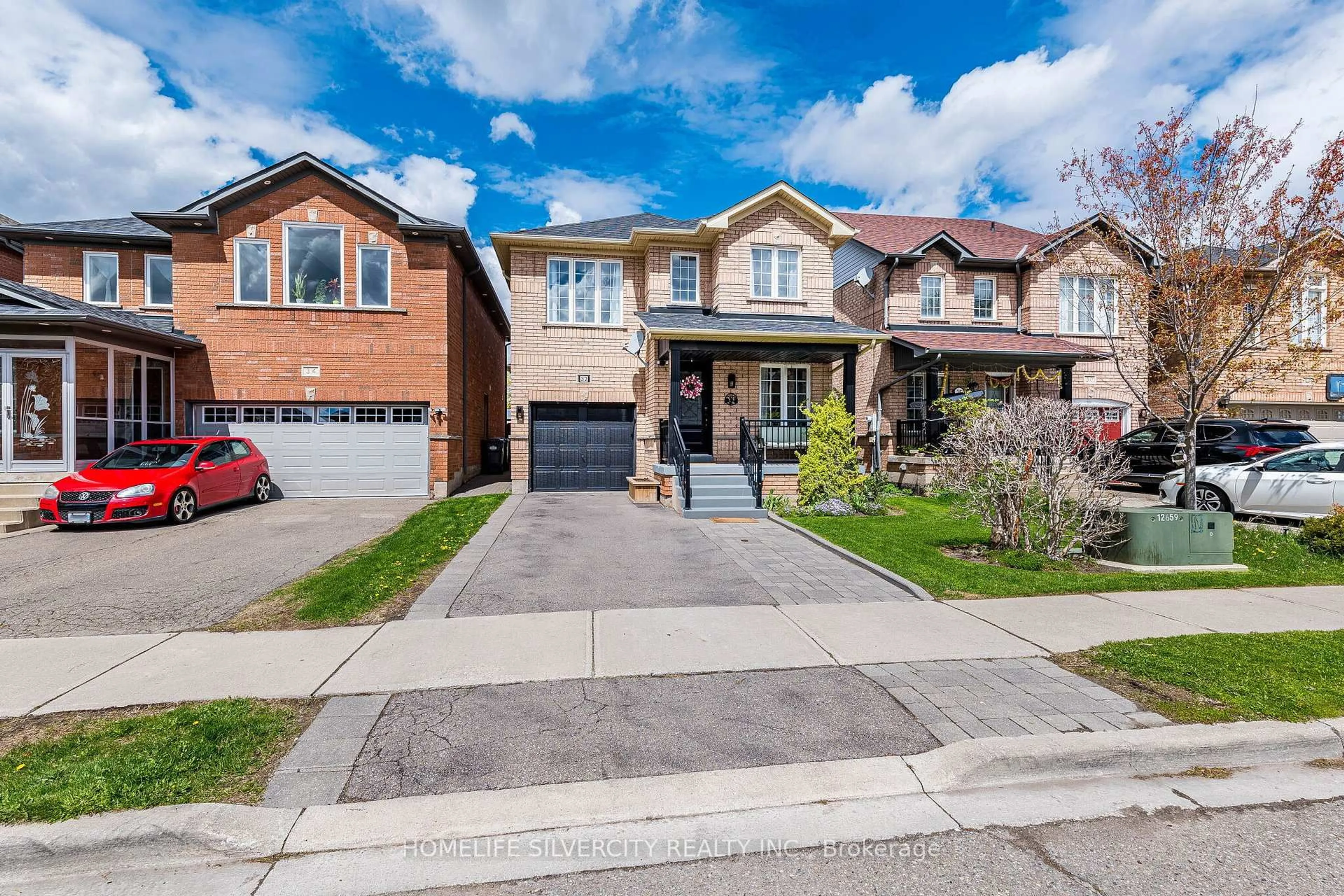 Home with brick exterior material, street for 32 Continental Rd, Brampton Ontario L7A 2E9