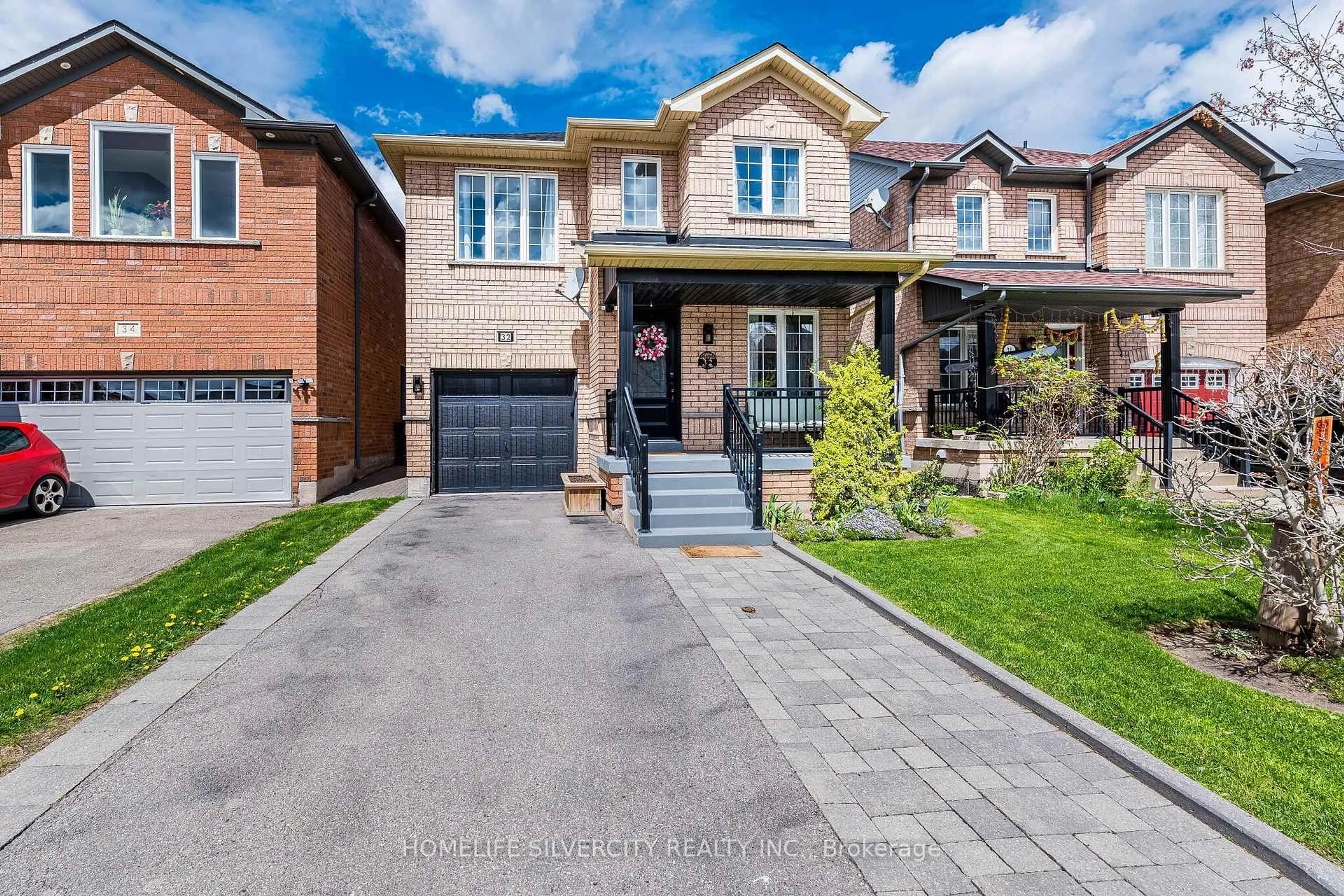 Home with brick exterior material, street for 32 Continental Rd, Brampton Ontario L7A 2E9