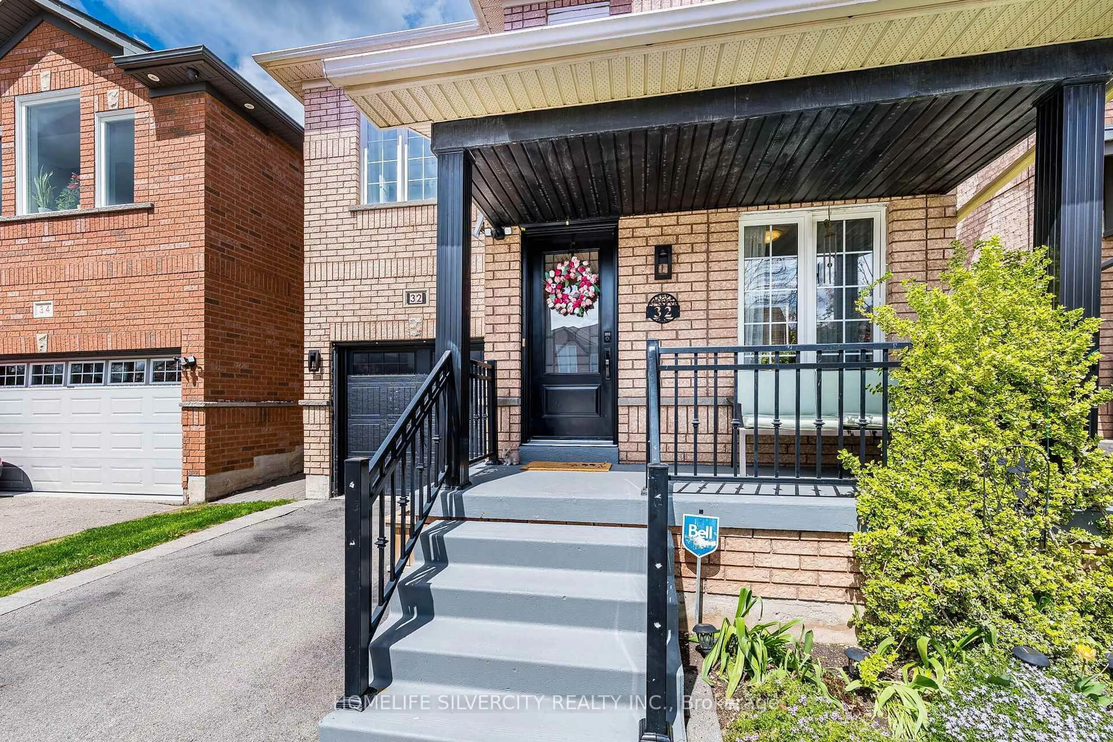 Home with brick exterior material, street for 32 Continental Rd, Brampton Ontario L7A 2E9