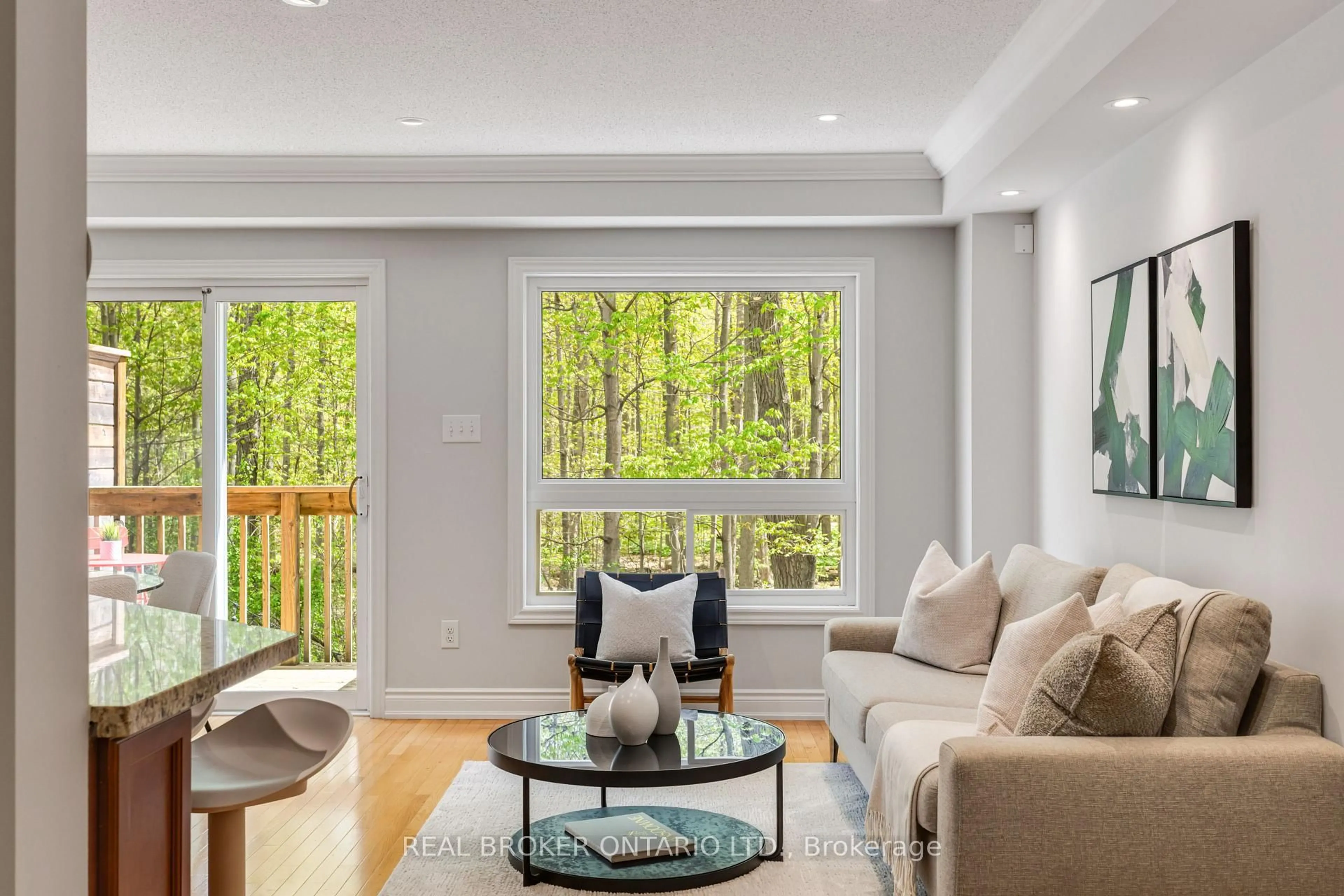 Living room with furniture, wood/laminate floor for 233 Duskywing Way #33, Oakville Ontario L6L 0C5