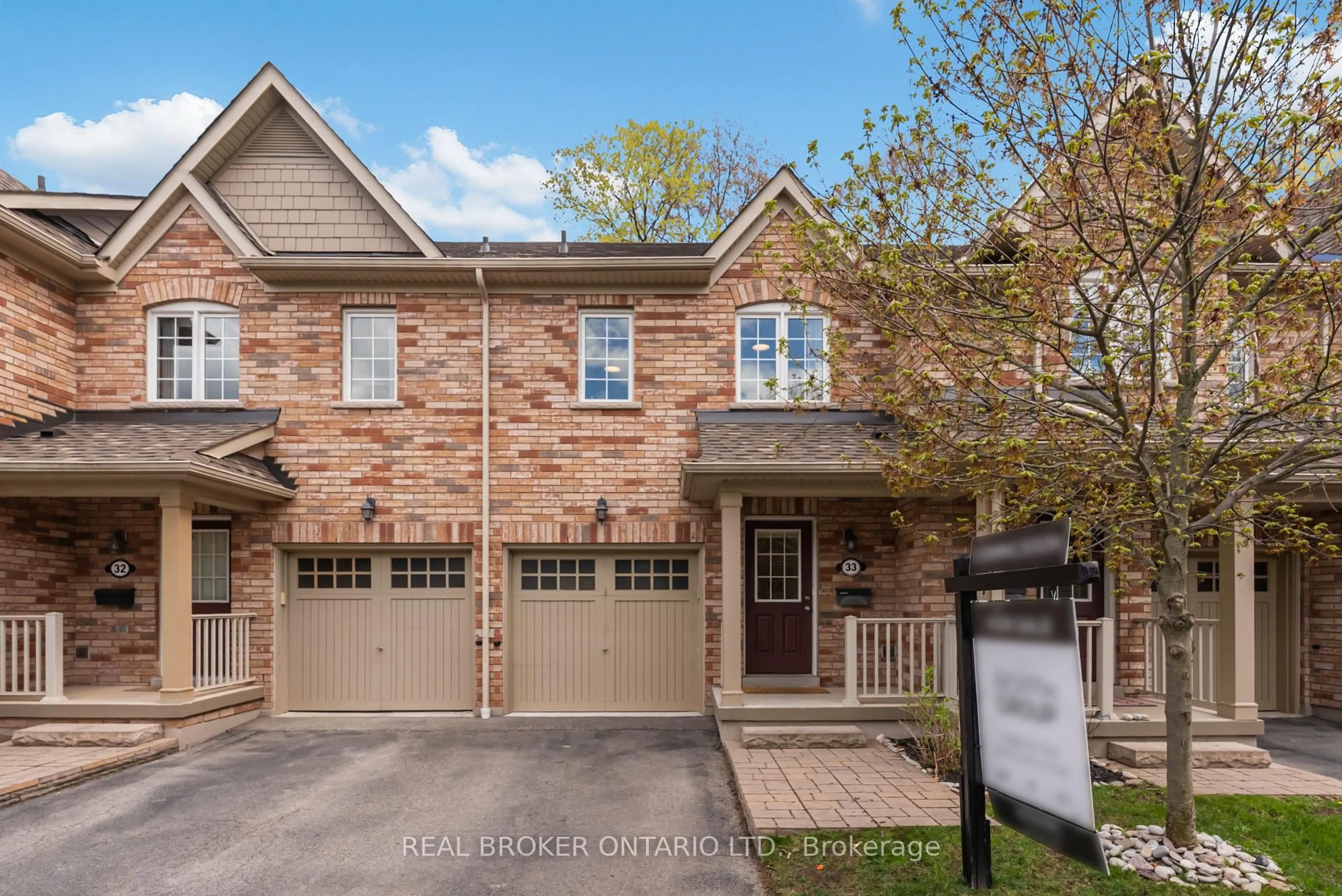 Home with brick exterior material, street for 233 Duskywing Way #33, Oakville Ontario L6L 0C5
