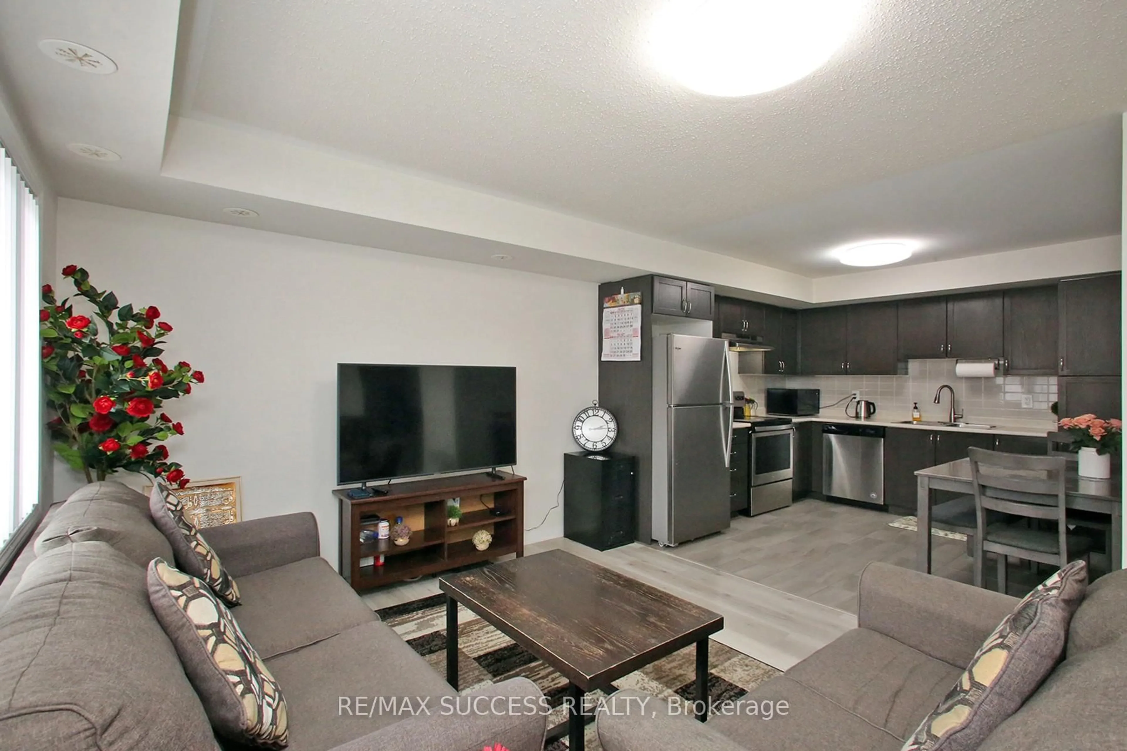 Living room with furniture, unknown for 250 Sunny Meadow Blvd #320, Brampton Ontario L6R 3Y7