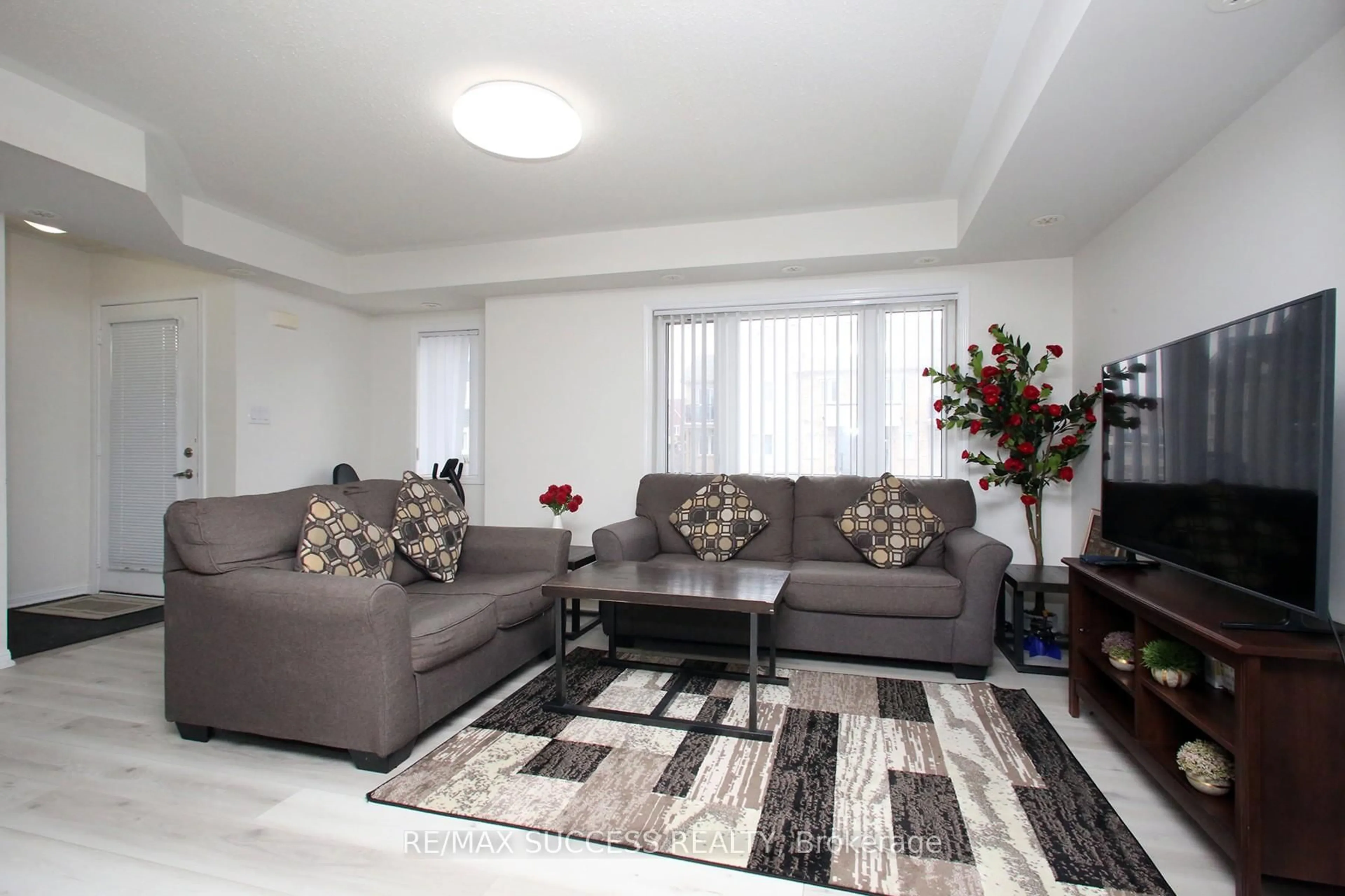 Living room with furniture, carpet floor for 250 Sunny Meadow Blvd #320, Brampton Ontario L6R 3Y7
