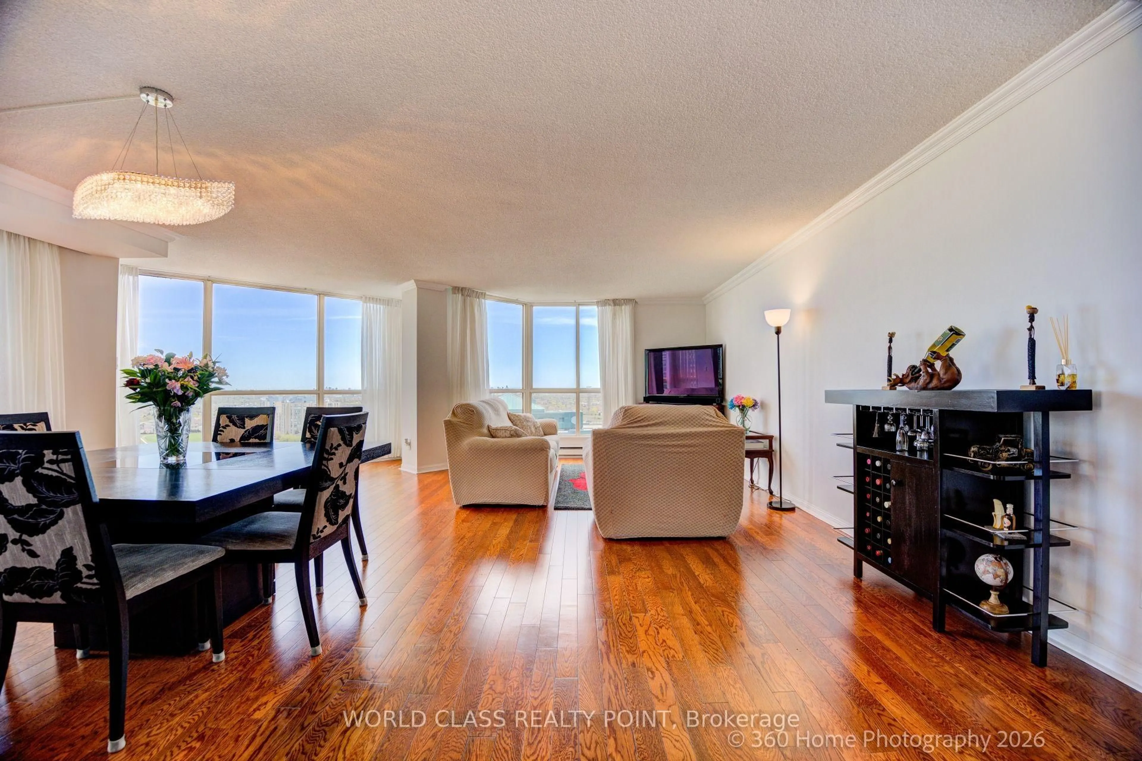 Living room with furniture, wood/laminate floor for 55 Kingsbridge Garden Circ #1811, Mississauga Ontario L5R 1Y1
