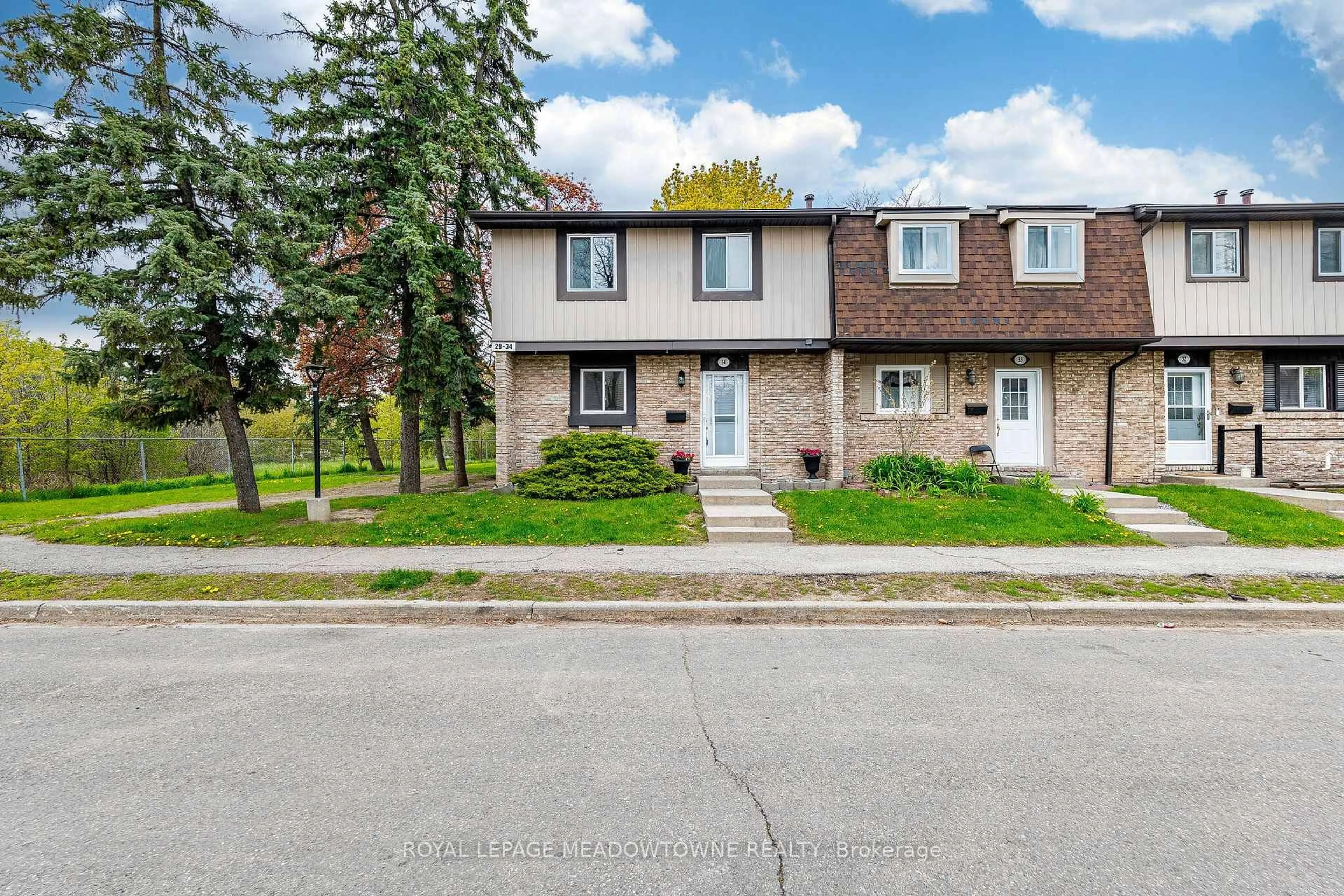 Home with brick exterior material, street for 93 Hansen Rd #34, Brampton Ontario L6V 3C8