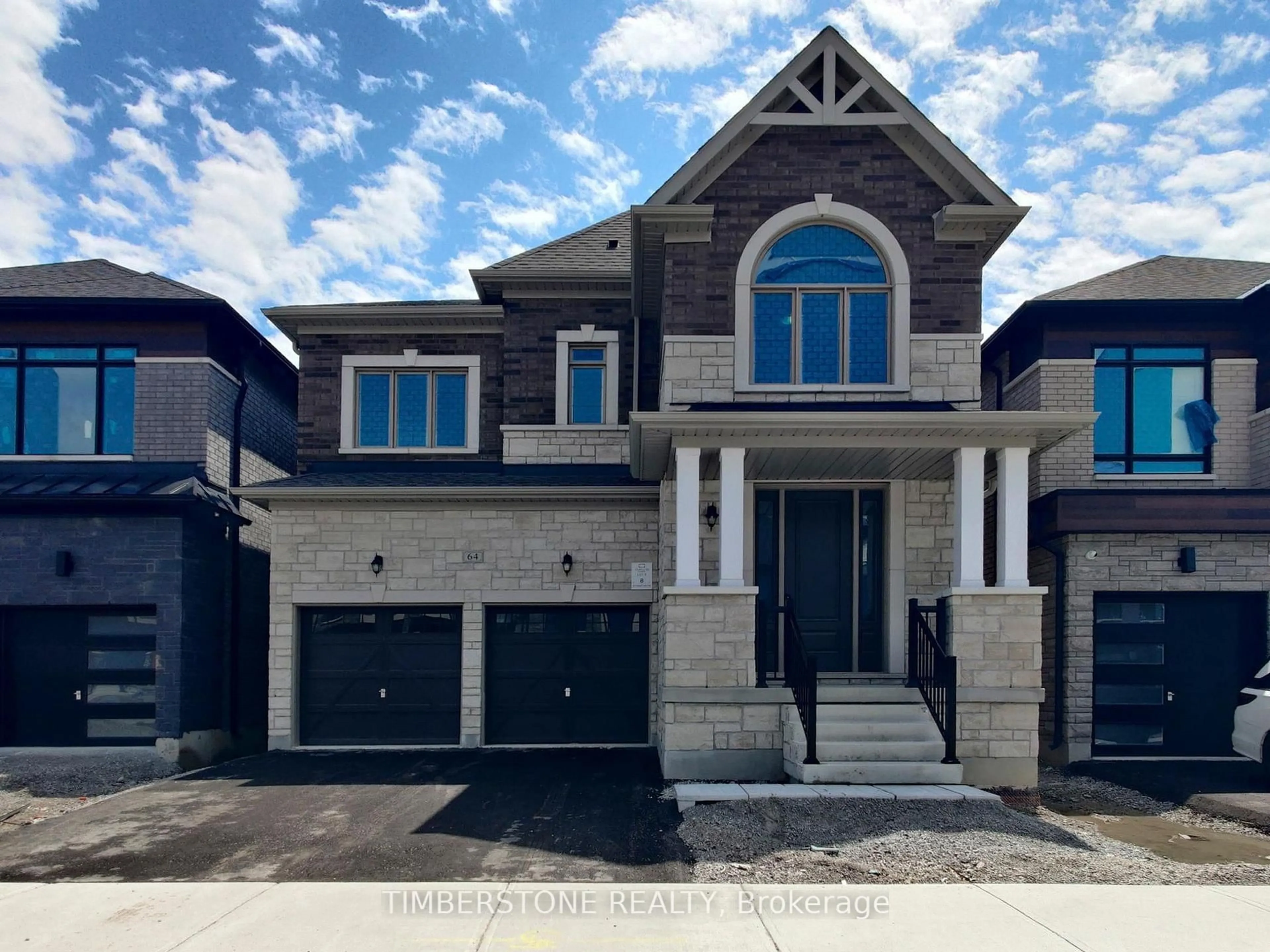 Home with brick exterior material, street for 64 Freedom Oaks Tr, Brampton Ontario L6P 4R8