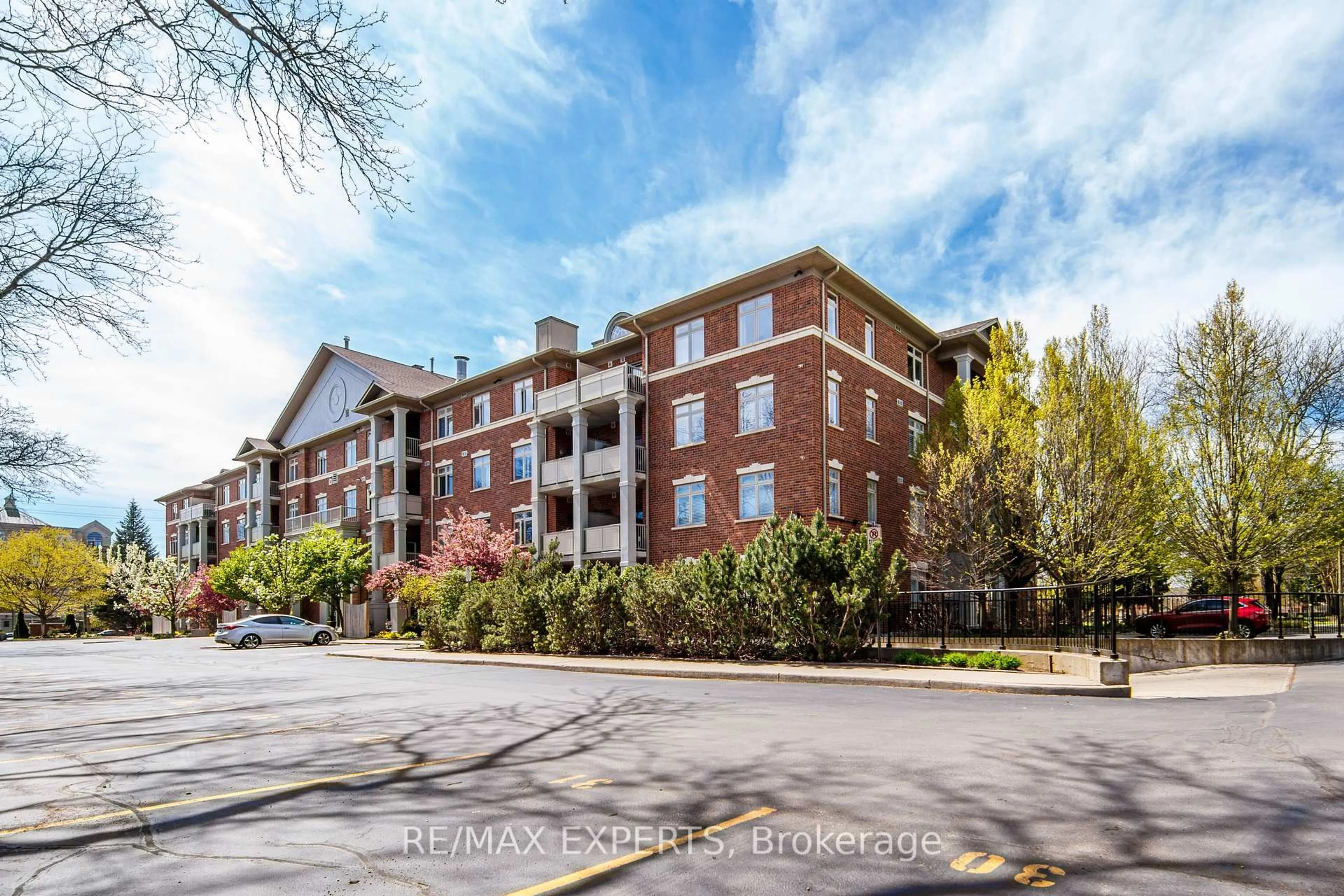 A pic from outside/outdoor area/front of a property/back of a property/a pic from drone, unknown for 391 Plains Rd #102, Burlington Ontario L7T 4M2