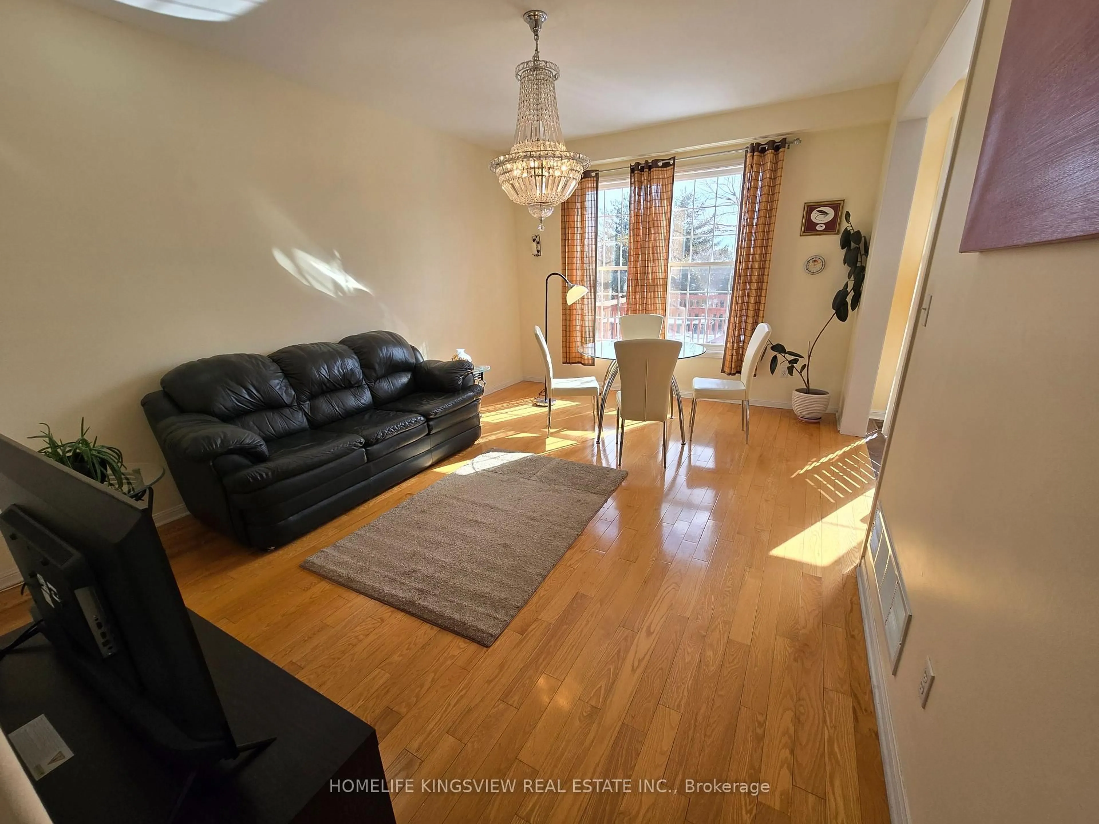 Living room with furniture, wood/laminate floor for 40 Vista Green Cres, Brampton Ontario L7A 2S3