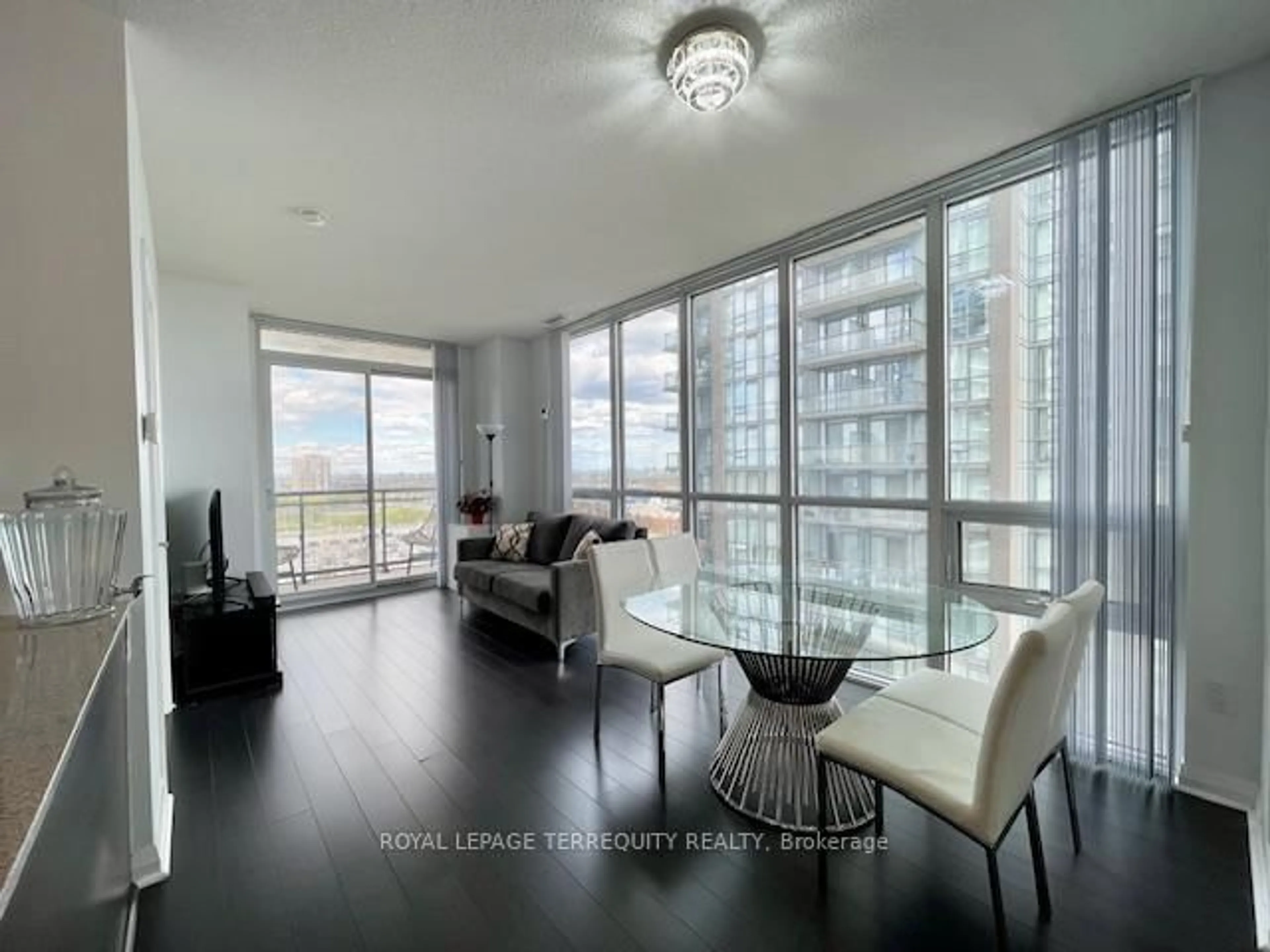 Living room with furniture, wood/laminate floor for 5033 Four Springs Ave #1219, Mississauga Ontario L5R 0G6