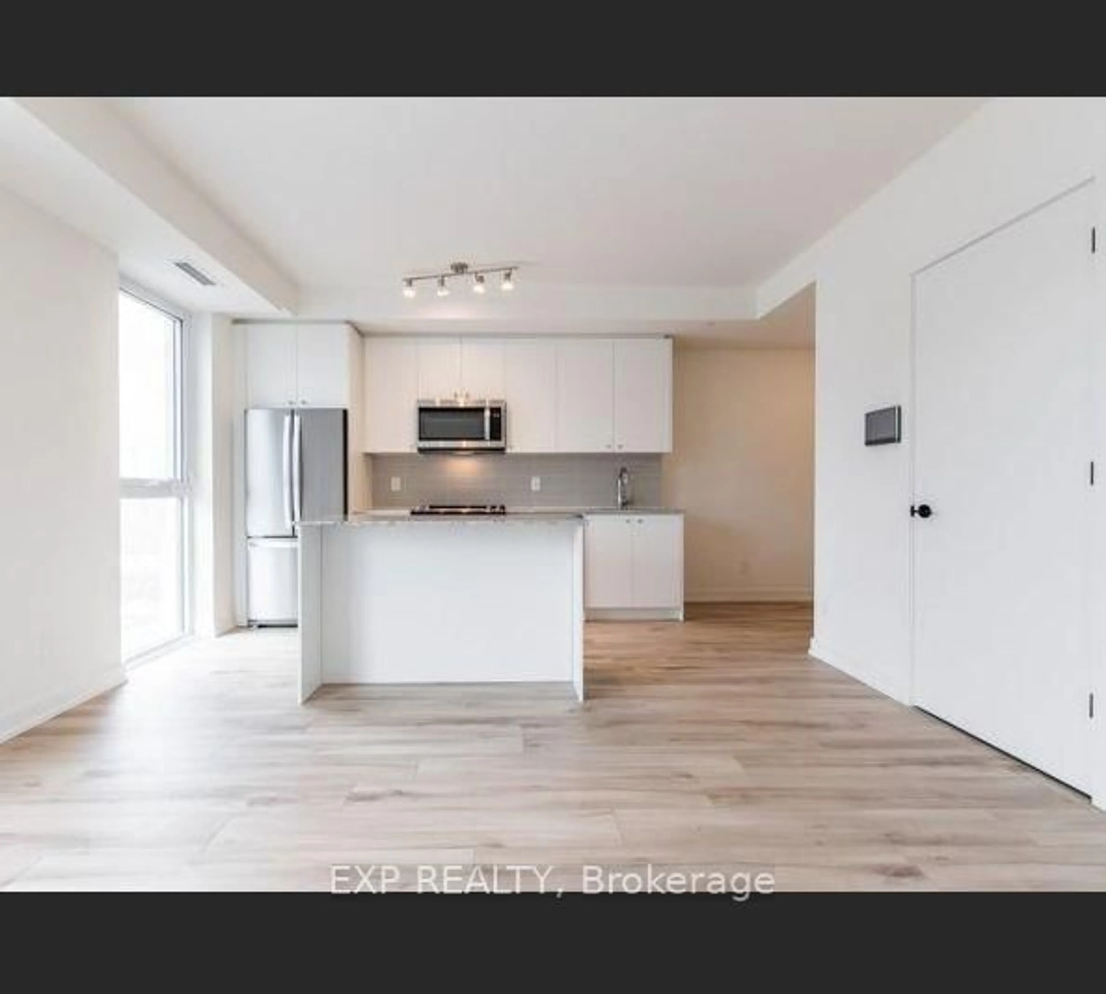 Open concept kitchen, wood/laminate floor for 335 Wheat Boom Dr #305, Oakville Ontario L6H 7Y1