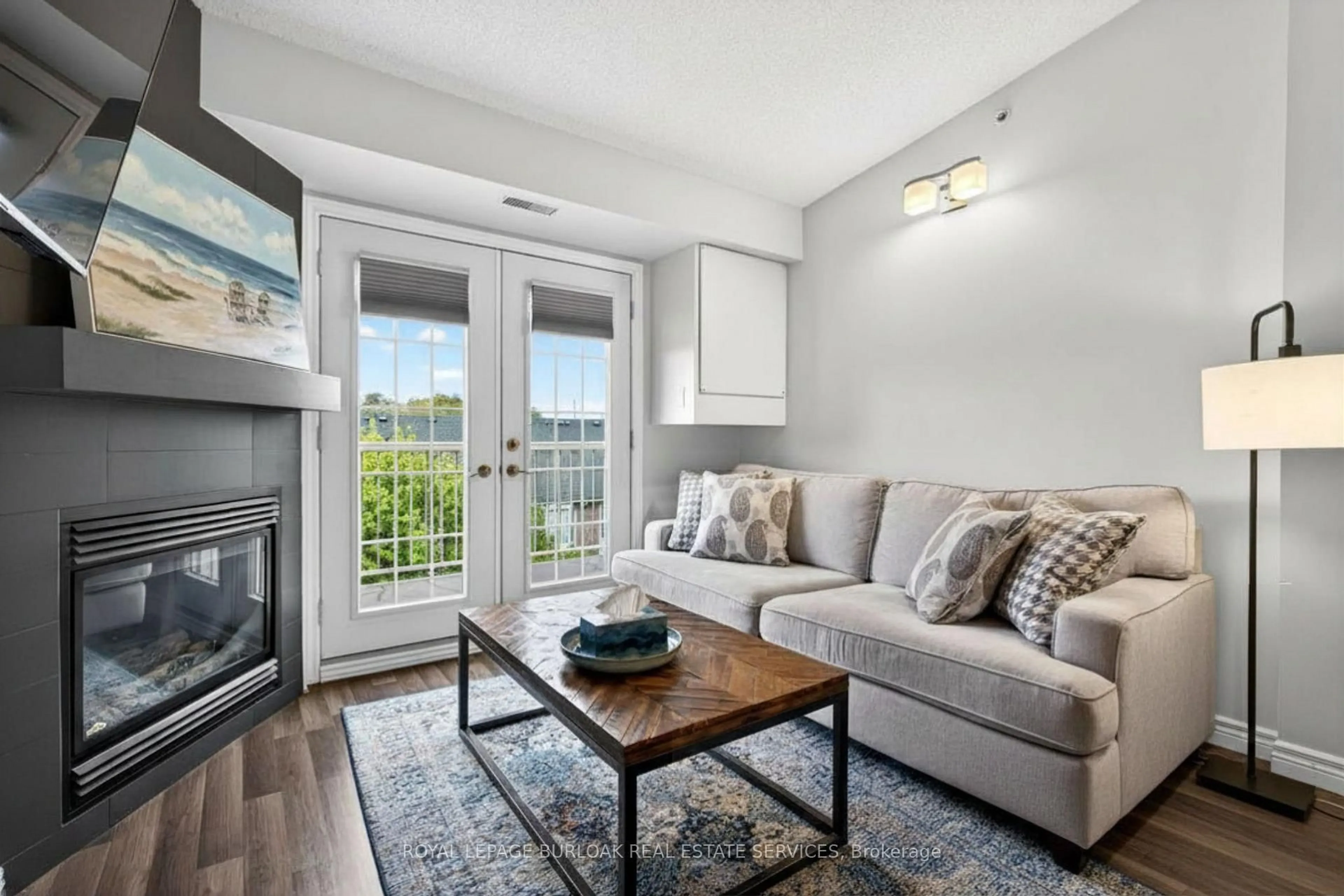Living room with furniture, wood/laminate floor for 1820 Walker's Line #403, Burlington Ontario L7M 4V4