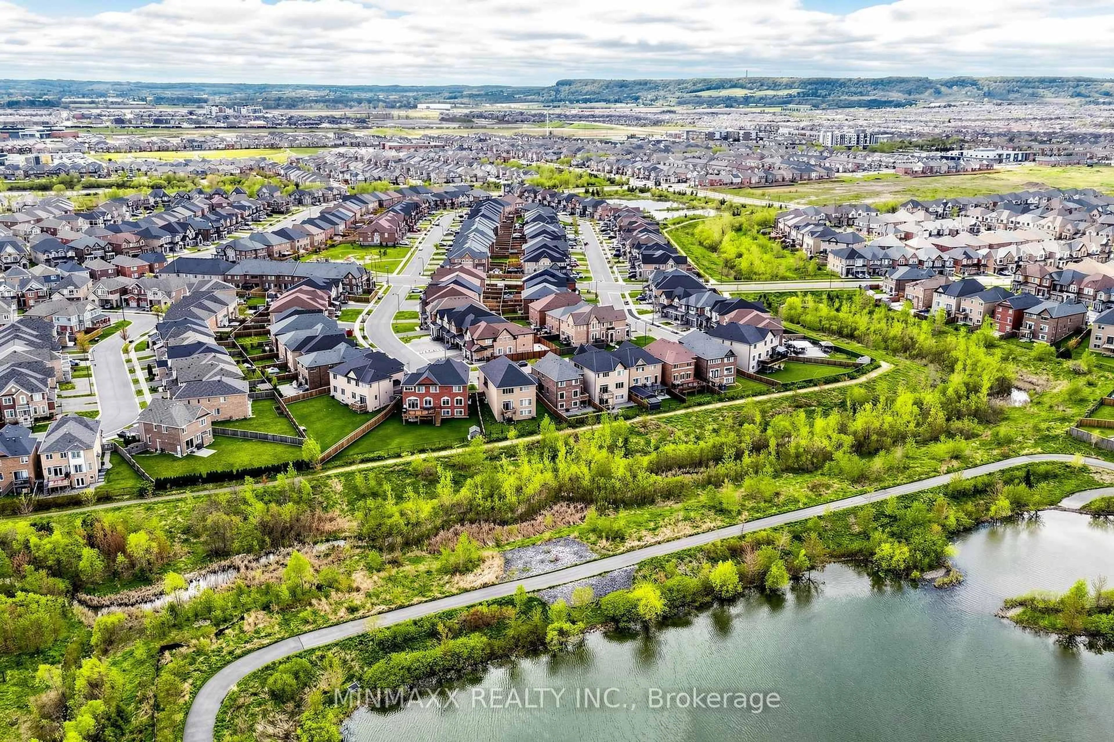 A pic from outside/outdoor area/front of a property/back of a property/a pic from drone, water/lake/river/ocean view for 571 Beam Crt, Milton Ontario L9E 1L3