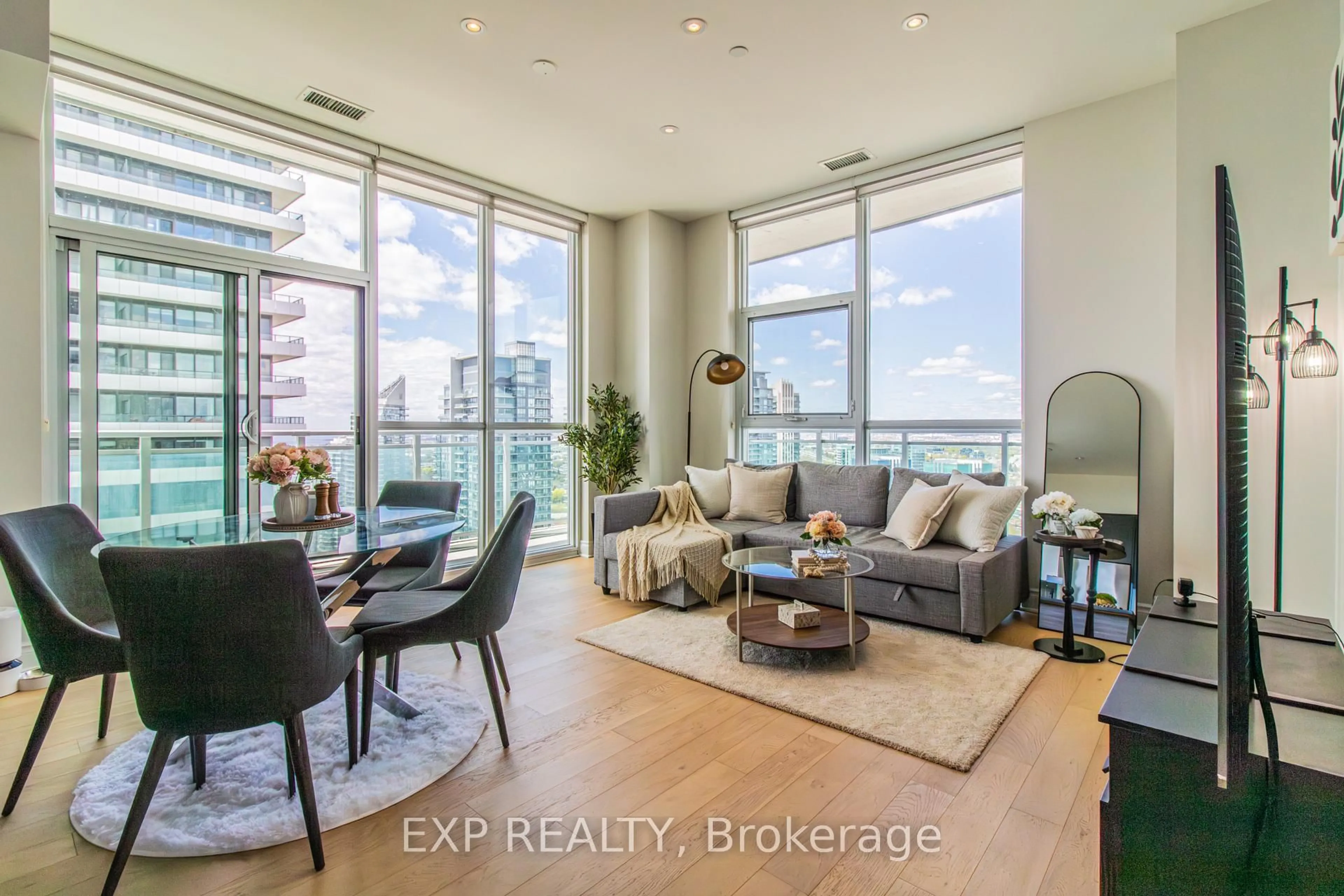 Living room with furniture, wood/laminate floor for 33 Shore Breeze Dr #LPH3802, Toronto Ontario M8V 0G1