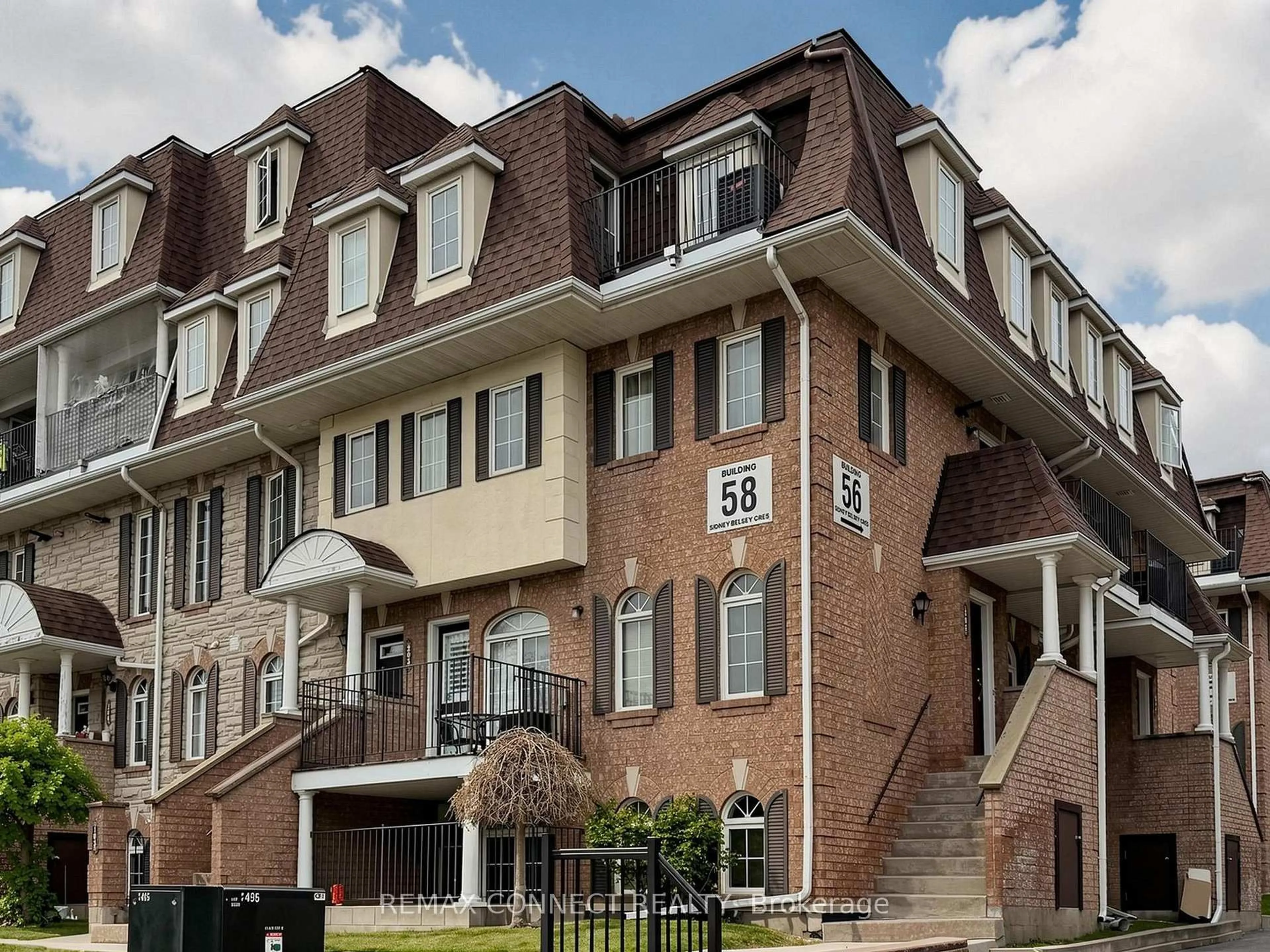 Home with brick exterior material, street for 58 Sidney Belsey Cres #304, Toronto Ontario M6M 5J2