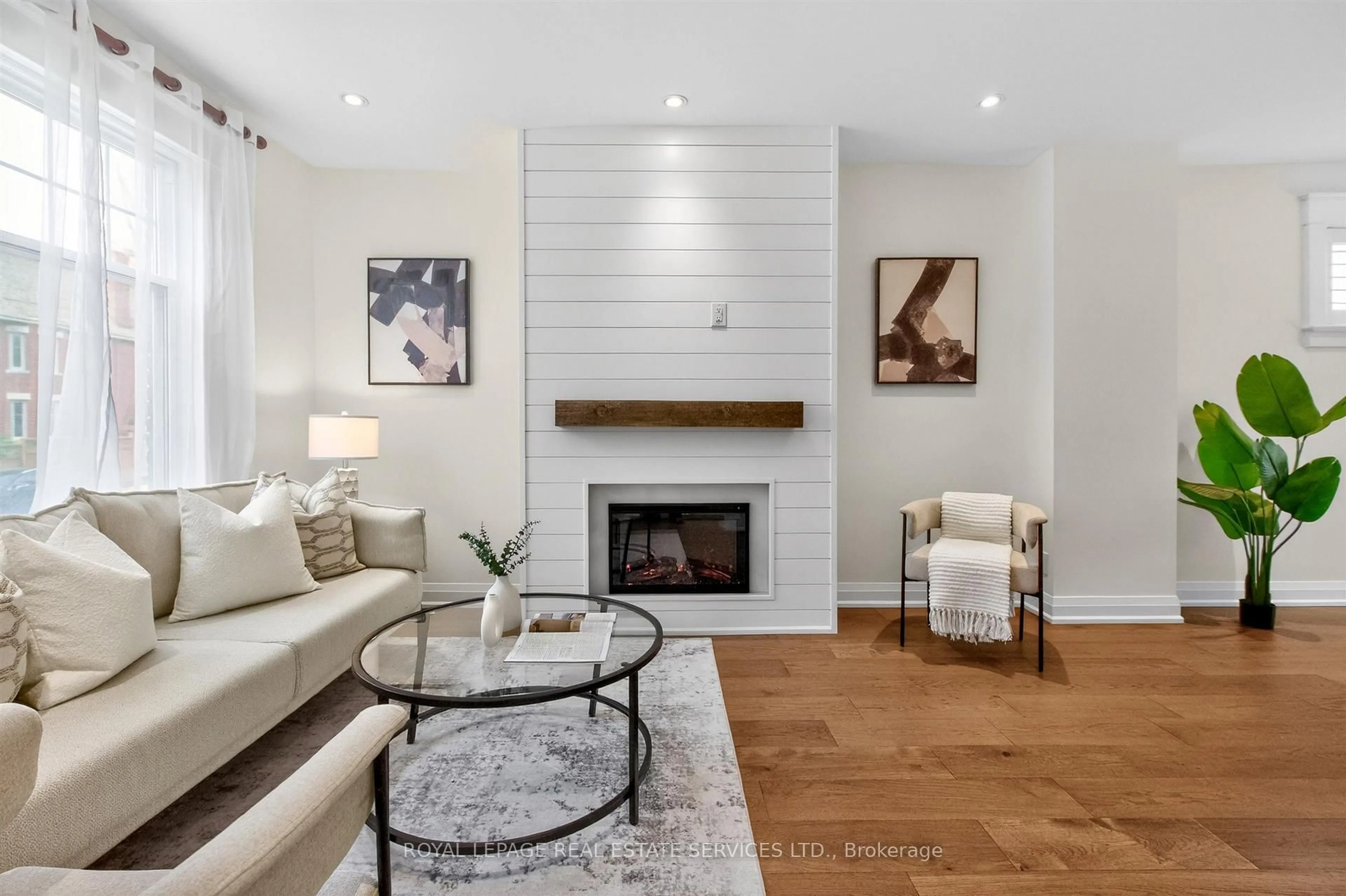 Living room with furniture, wood/laminate floor for 93 Medland Cres, Toronto Ontario M6P 2N3