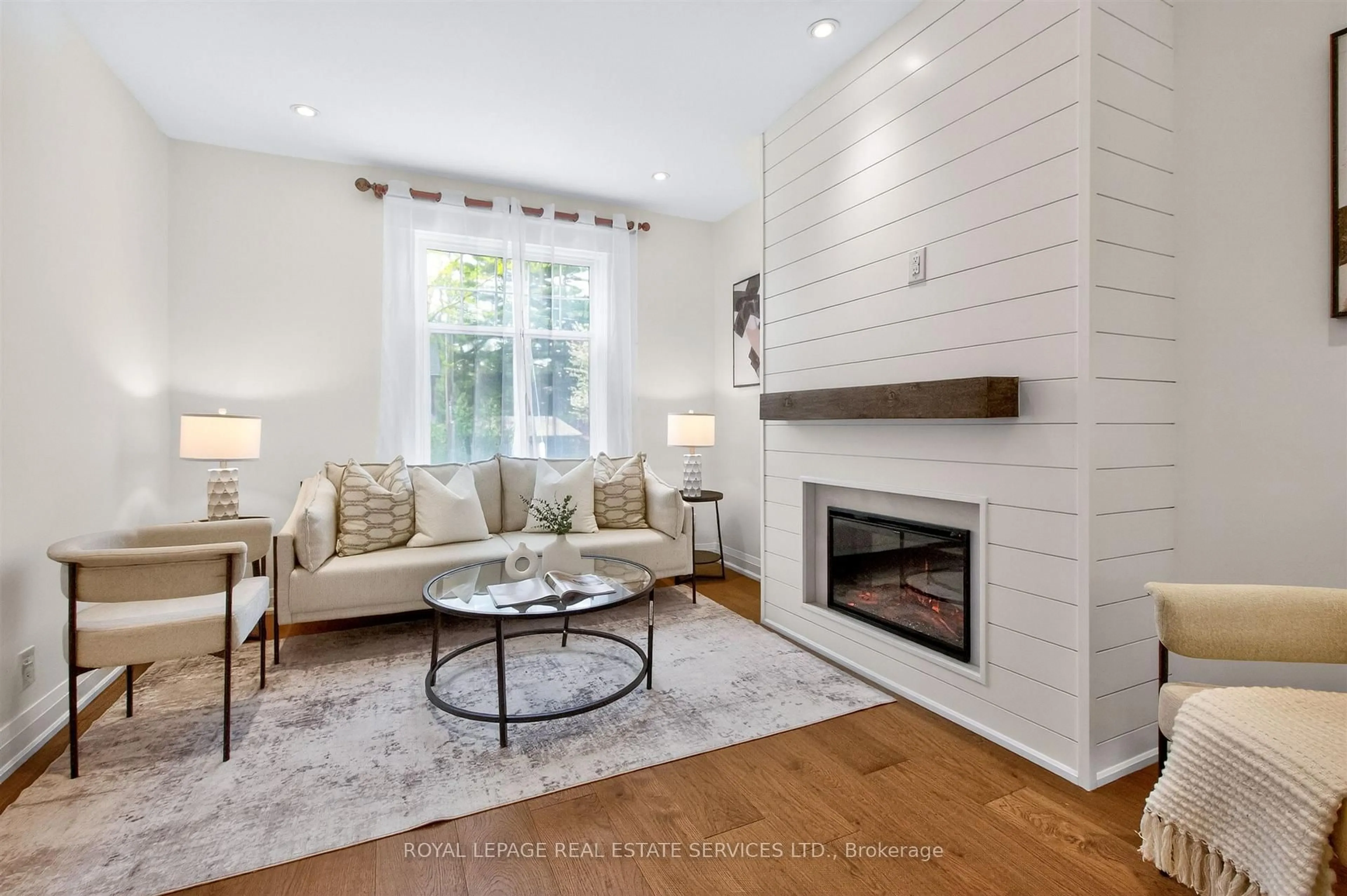 Living room with furniture, wood/laminate floor for 93 Medland Cres, Toronto Ontario M6P 2N3