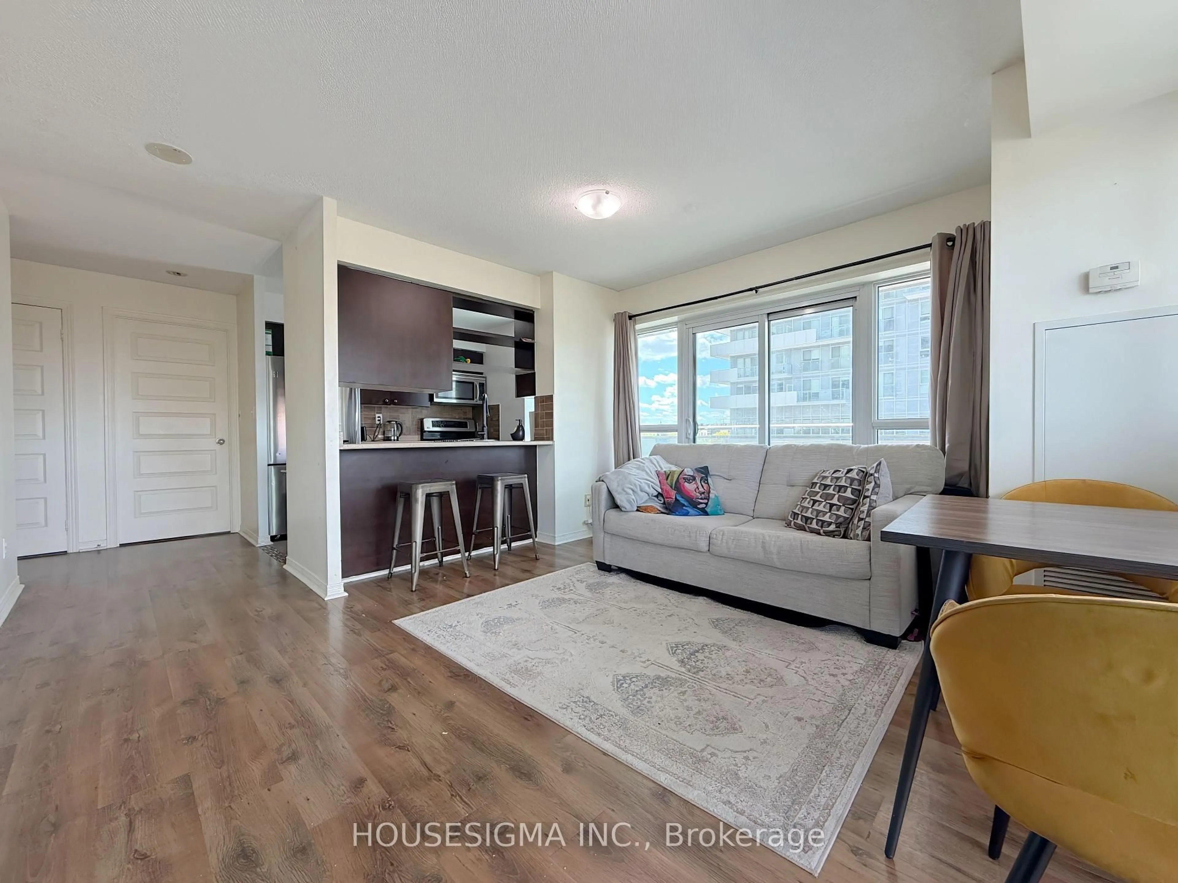 Living room with furniture, unknown for 215 Queen St #509, Brampton Ontario L6W 0A9