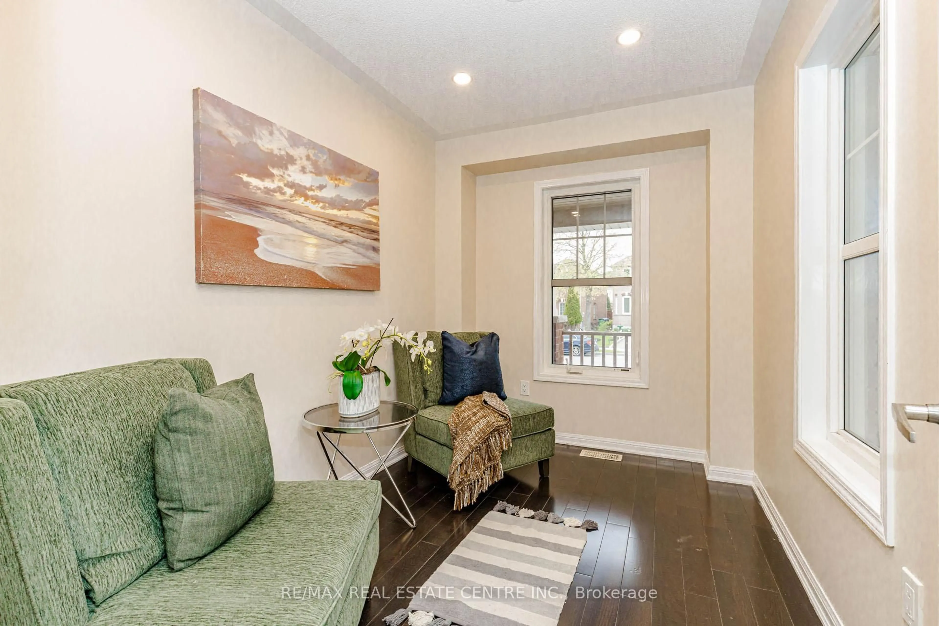 Living room with furniture, wood/laminate floor for 187 Lockwood Rd, Brampton Ontario L6Y 5W1