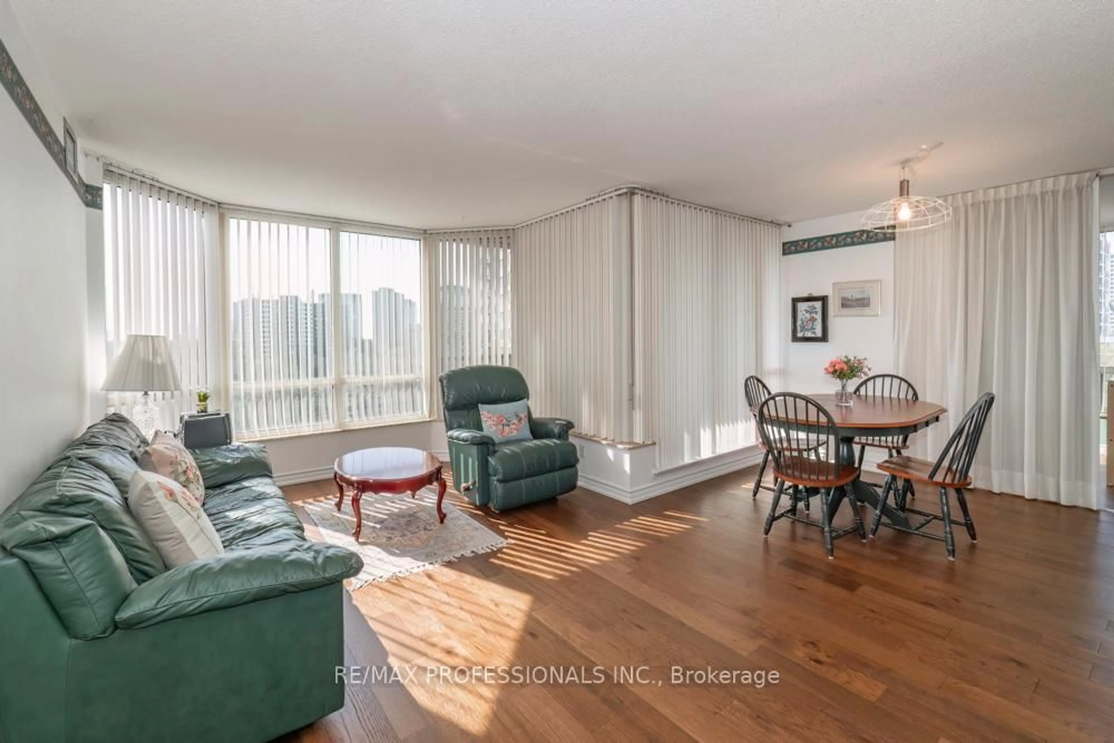 Living room with furniture, wood/laminate floor for 1320 Islington Ave #702, Toronto Ontario M9A 5C6