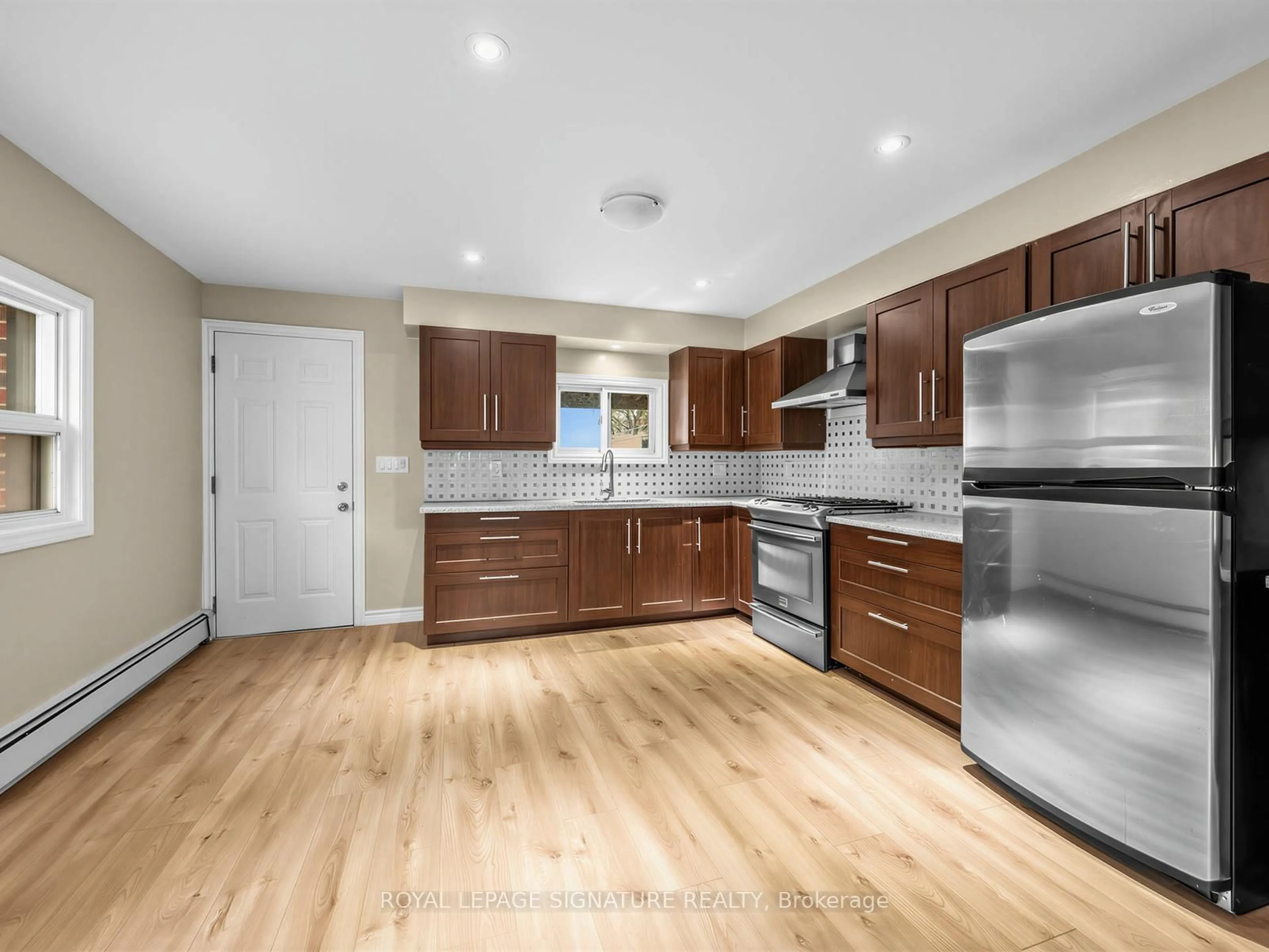 Open concept kitchen, wood/laminate floor for 1157 Roselawn Ave, Toronto Ontario M6B 1C5