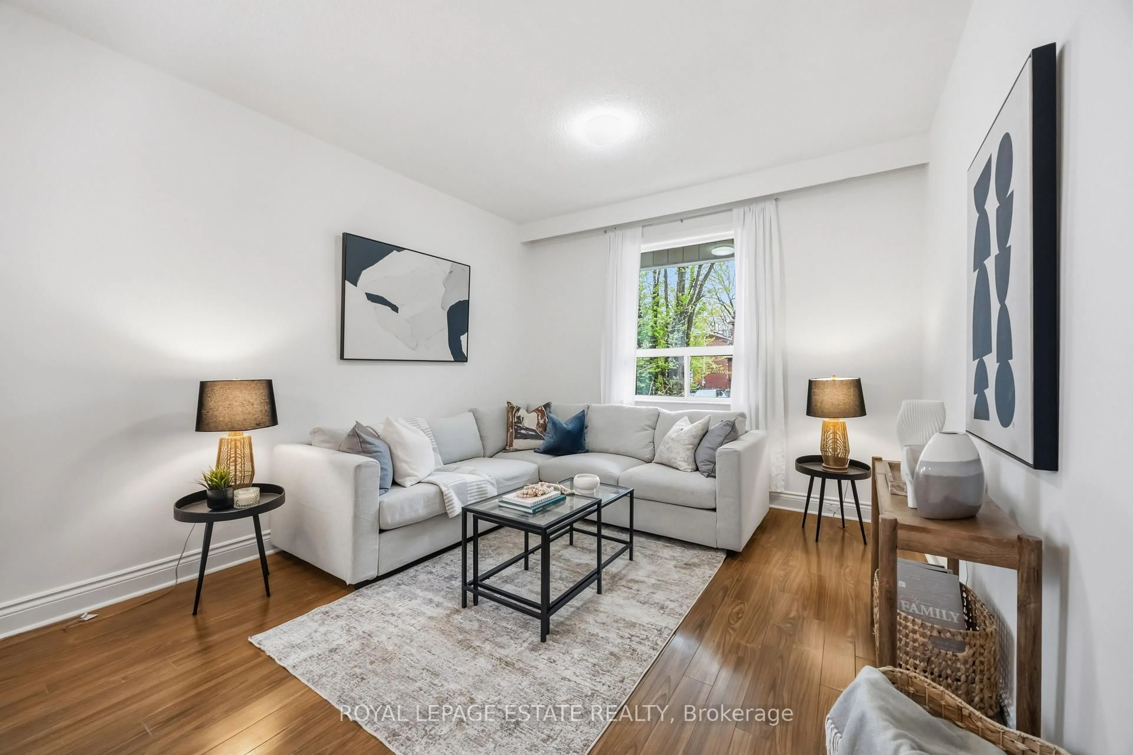 Living room with furniture, wood/laminate floor for 293 Harvie Ave, Toronto Ontario M6E 4L2