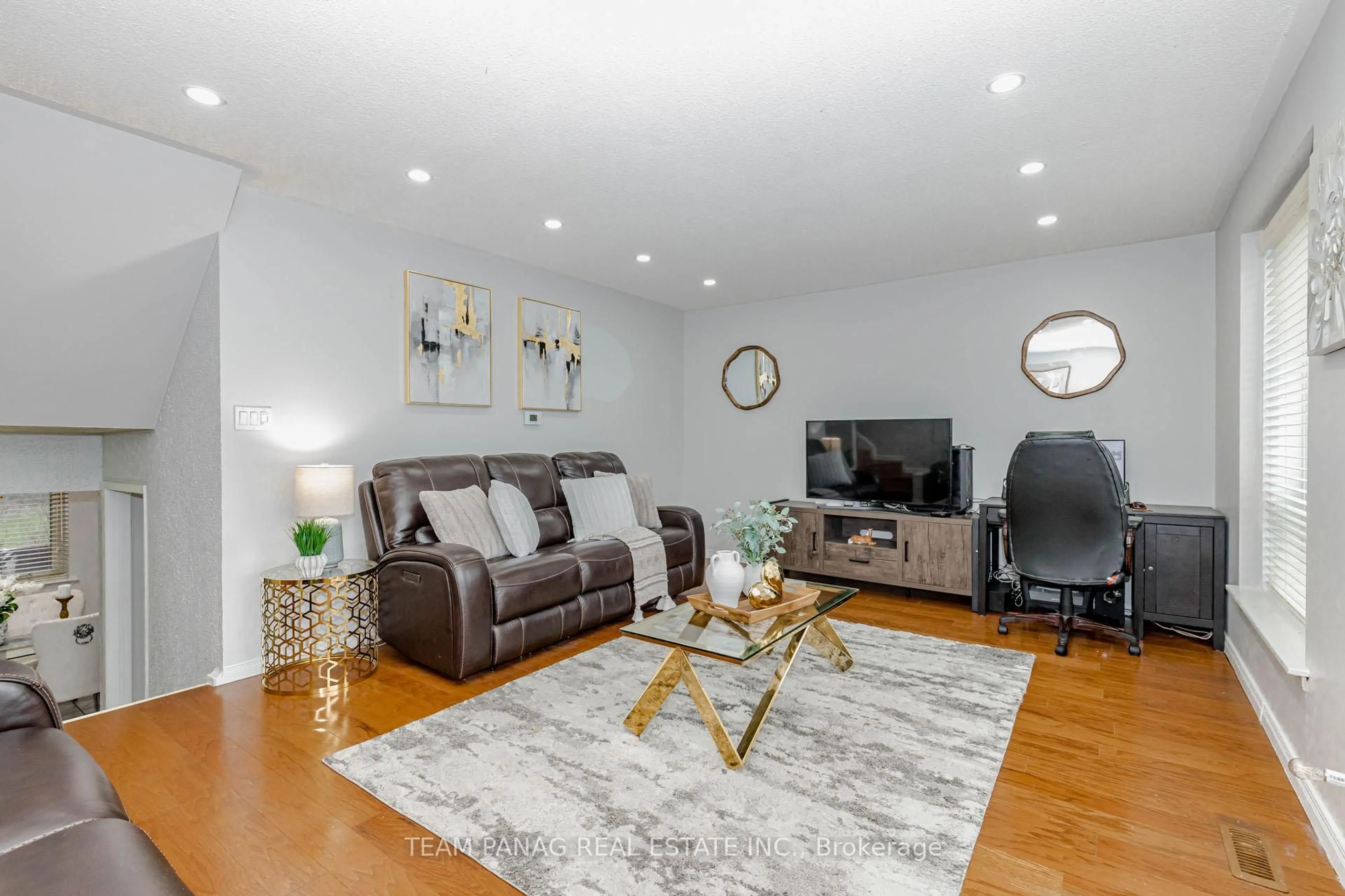 Living room with furniture, wood/laminate floor for 9 Kendleton Dr #30, Toronto Ontario M9V 1T6