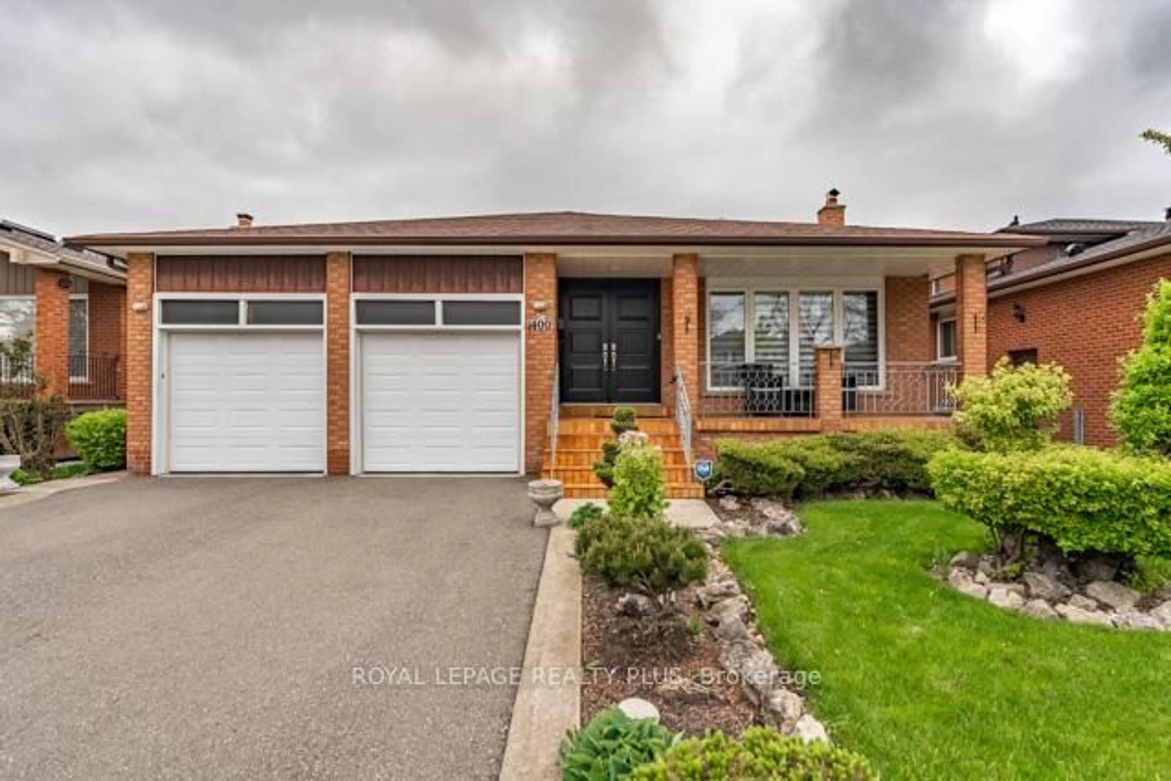 Home with brick exterior material, street for 1400 Bough Beeches Blvd, Mississauga Ontario L4W 3B5