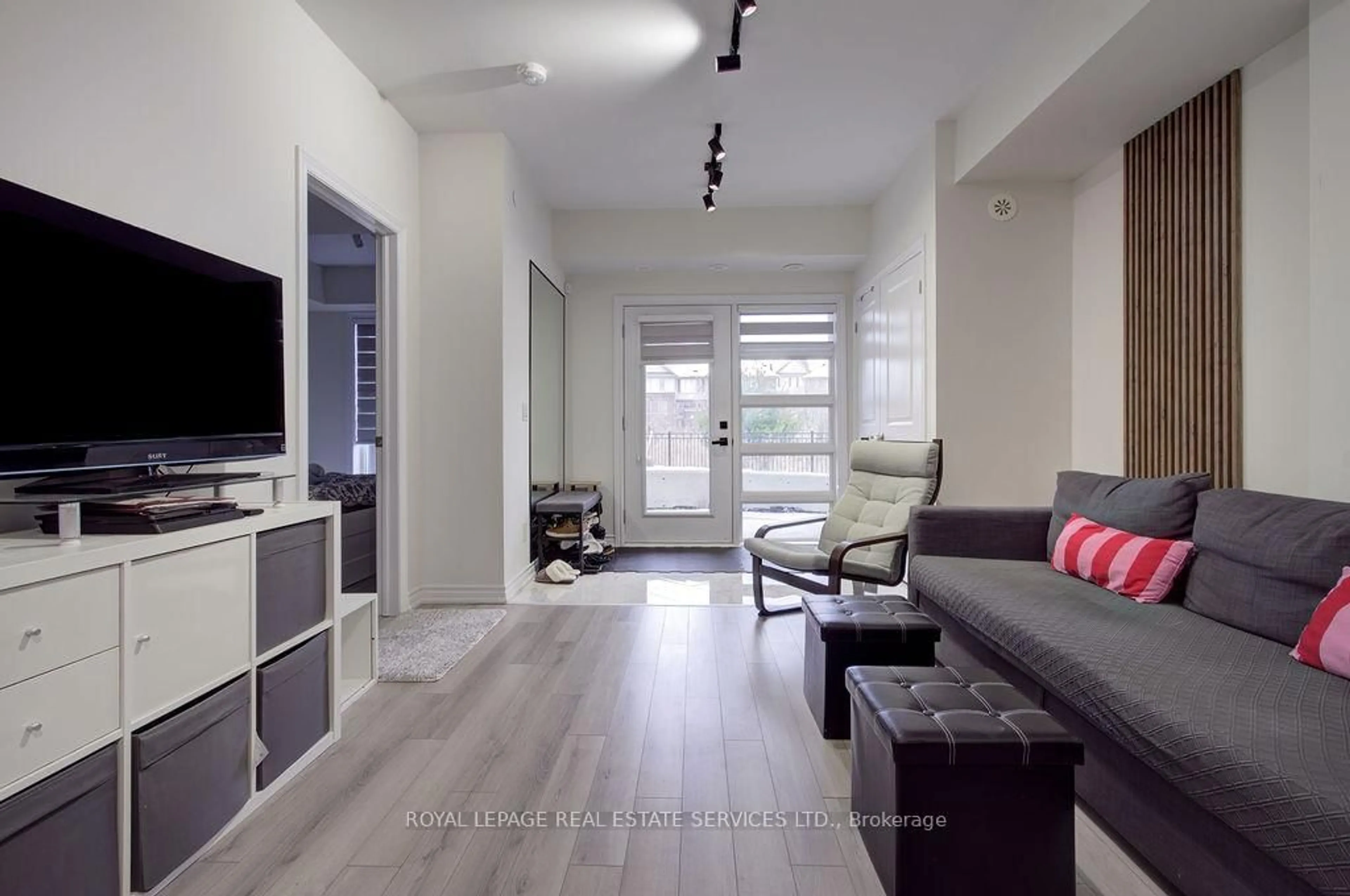 Living room with furniture, unknown for 349 Wheat Boom Dr #123, Oakville Ontario L6H 7X5
